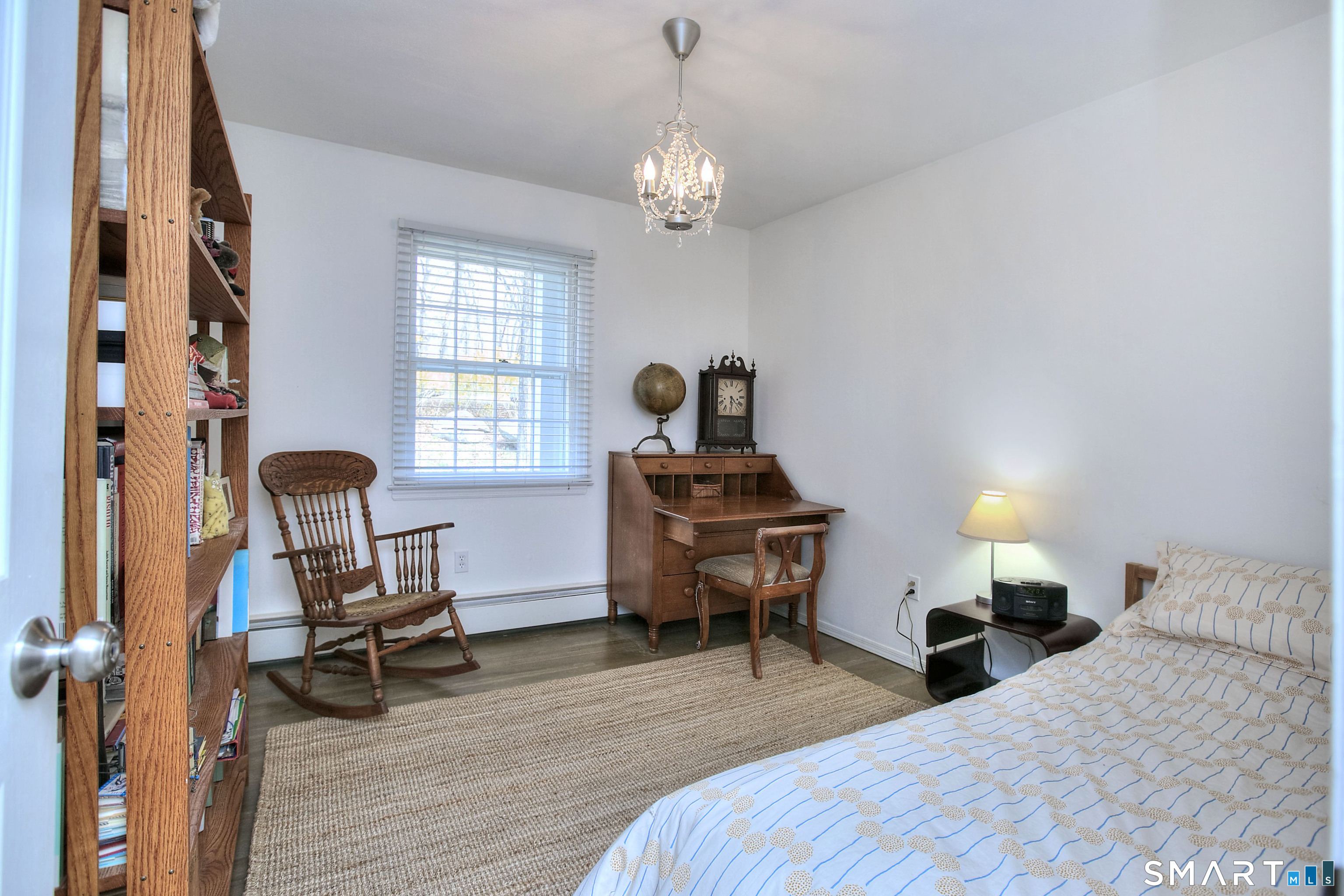 7 Richmond Hill Road Weston, CT 06883 - Photo 18 of 33 a bedroom with bed table chair and a window