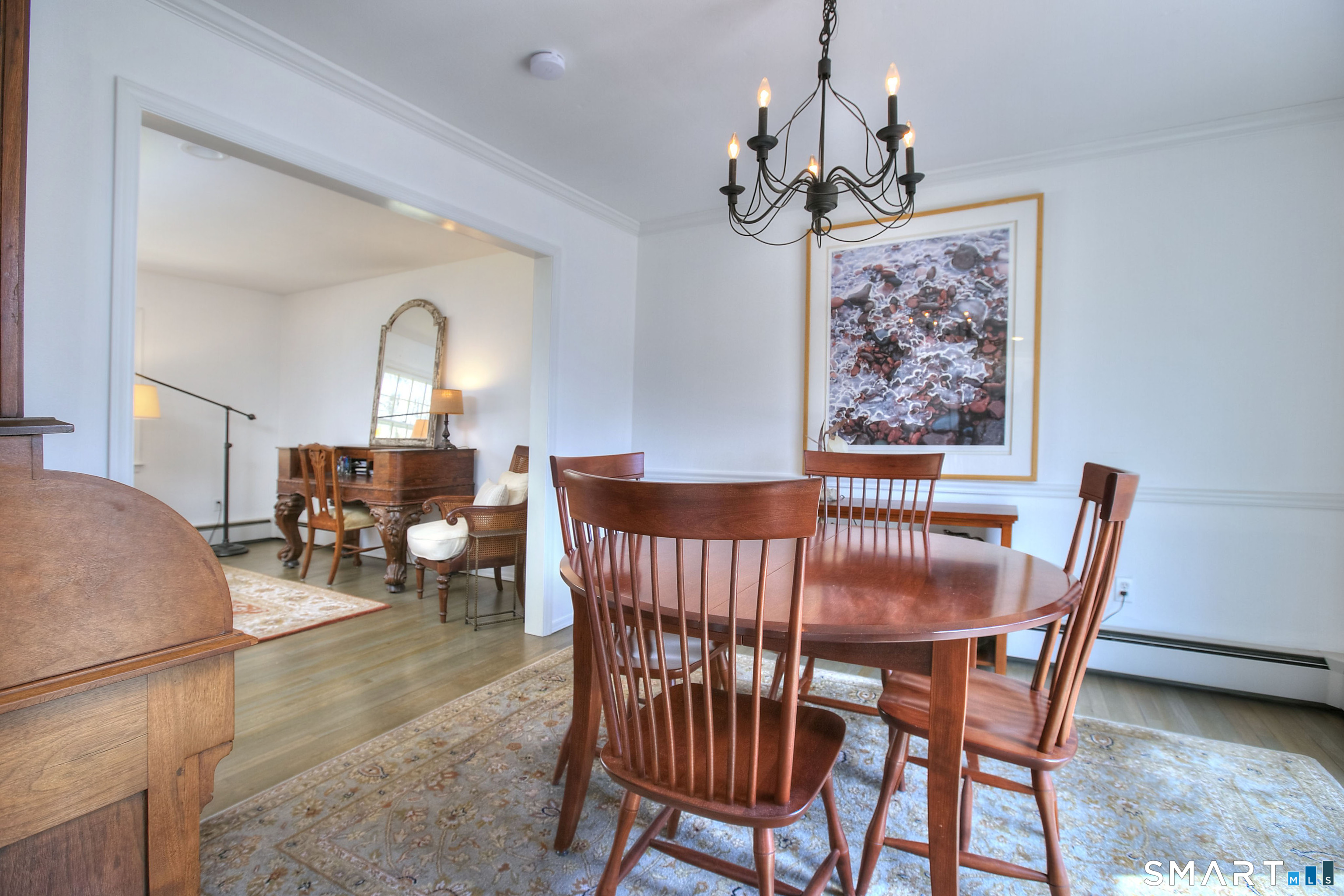 7 Richmond Hill Road Weston, CT 06883 - Photo 23 of 33 a view of a dining room with furniture wooden floor and a chandelier