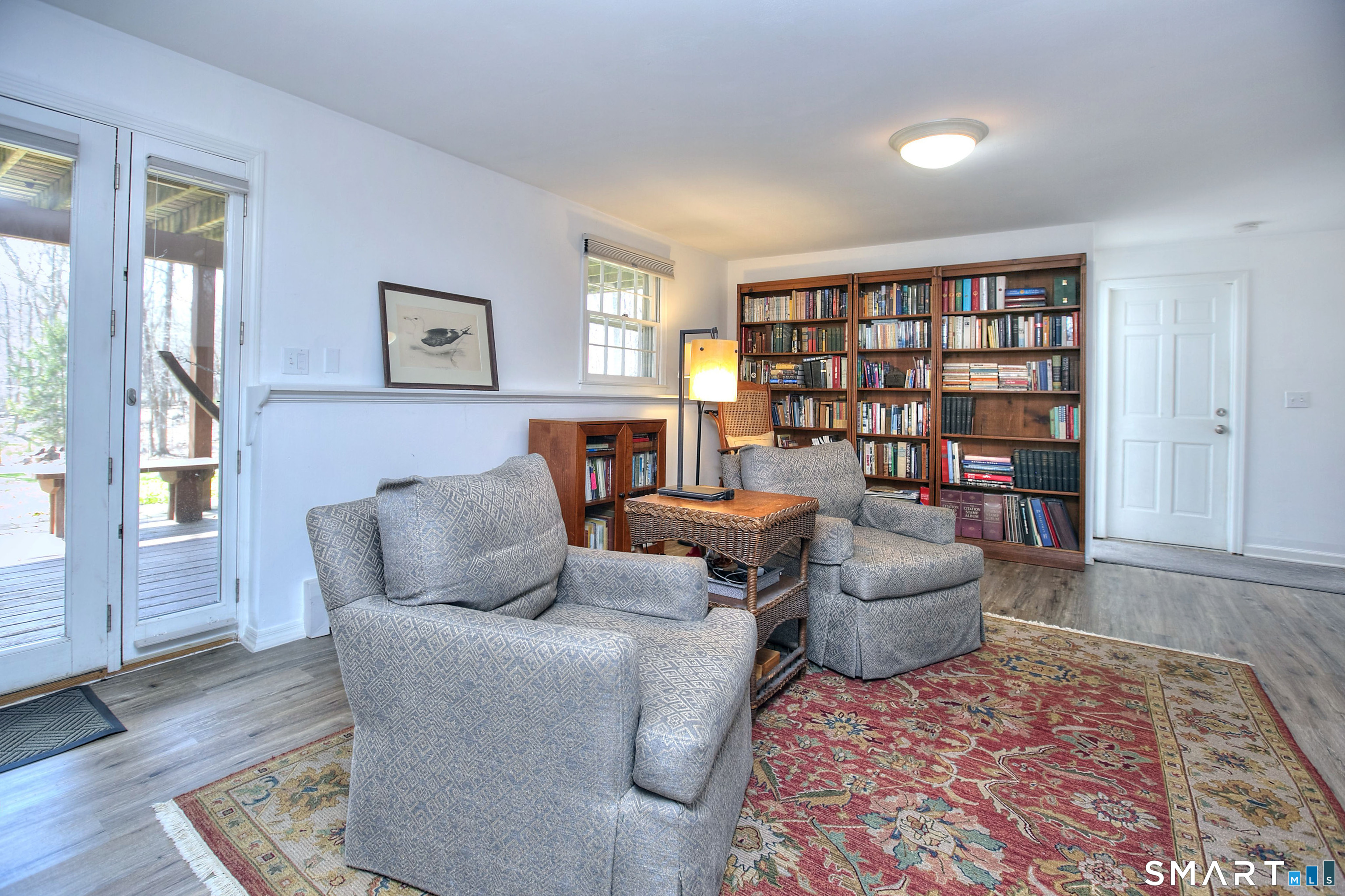 7 Richmond Hill Road Weston, CT 06883 - Photo 26 of 33 a living room with furniture and a book shelf