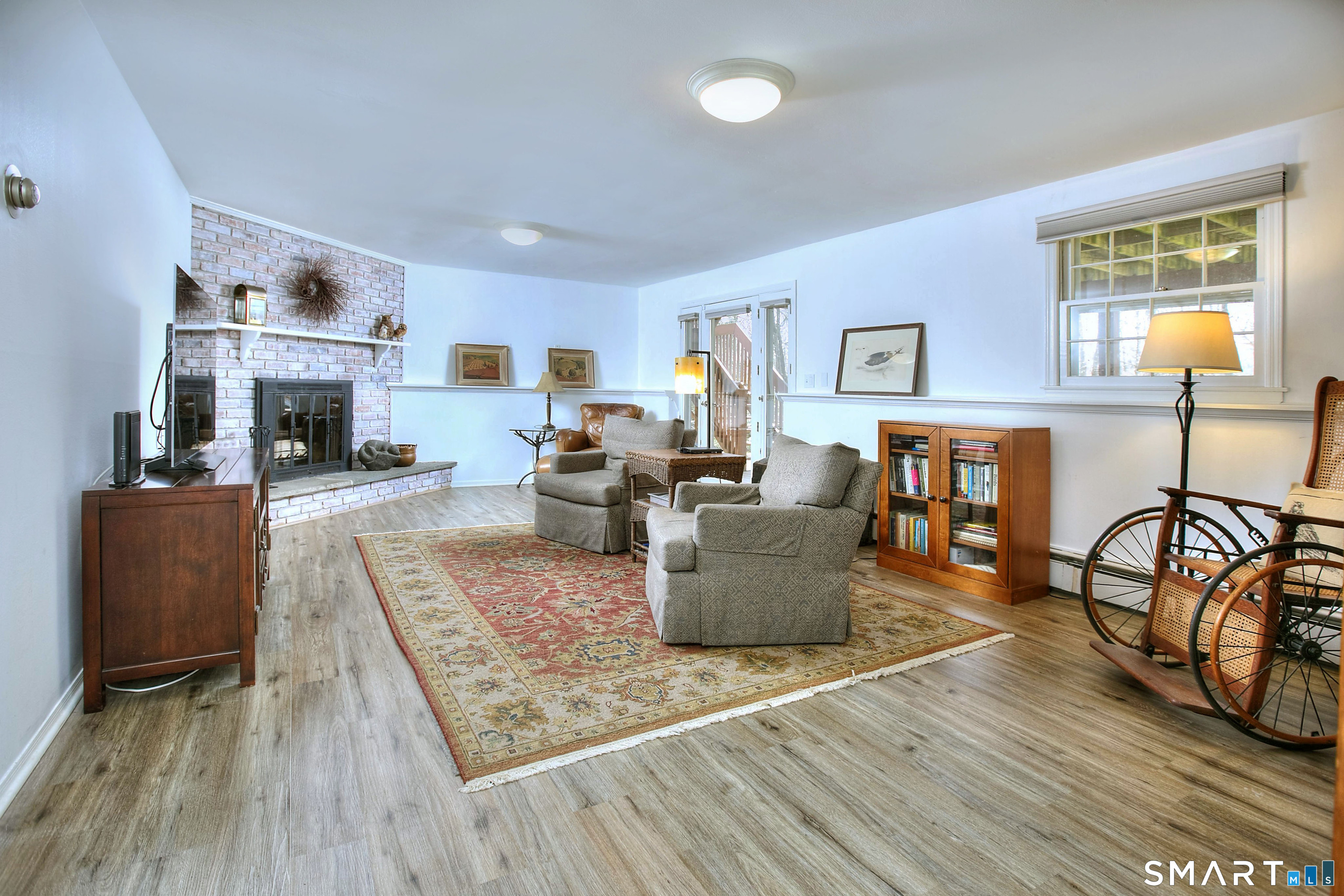 7 Richmond Hill Road Weston, CT 06883 - Photo 27 of 33 a living room with furniture and a fireplace