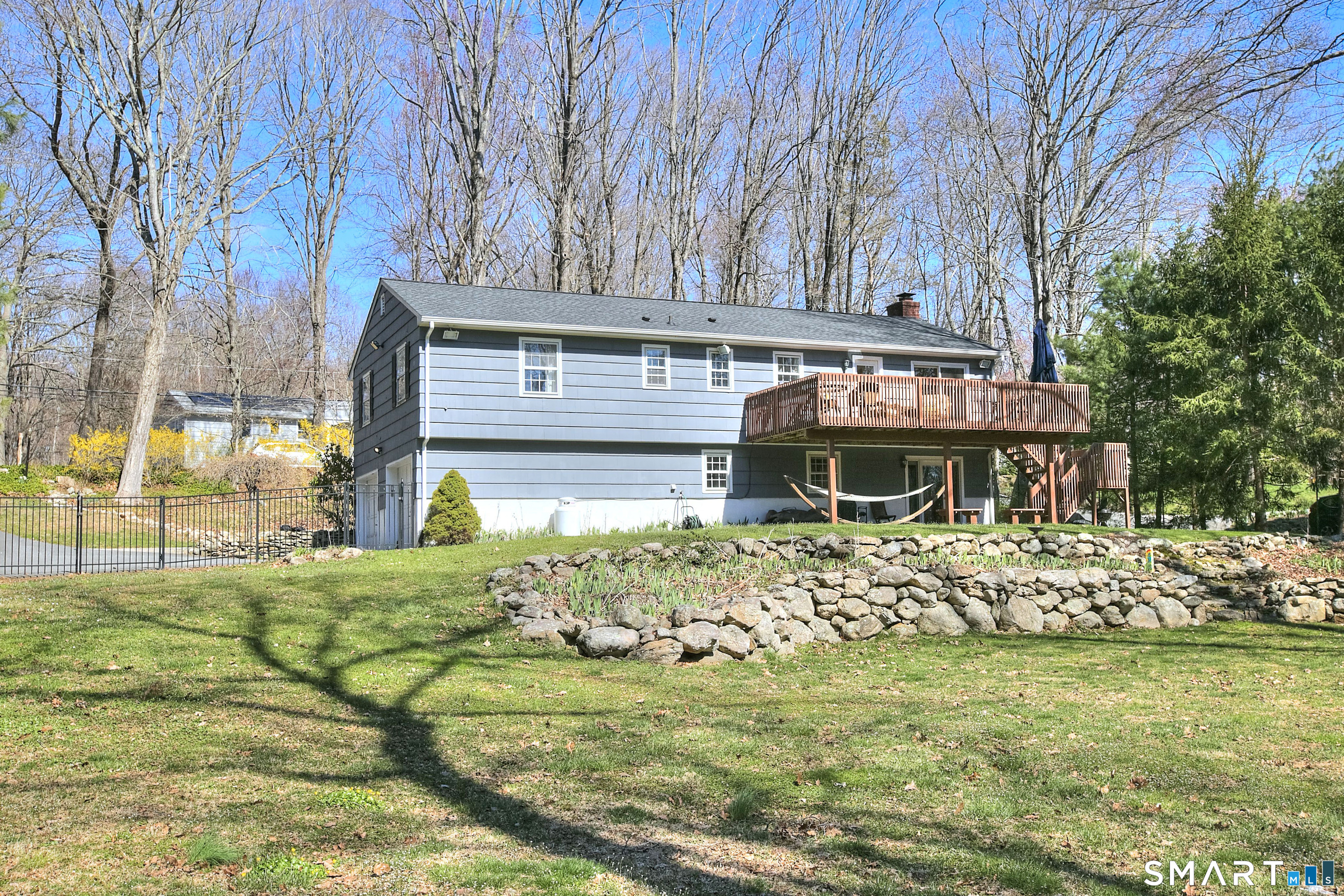 7 Richmond Hill Road Weston, CT 06883 - Photo 3 of 33 a front view of a house with garden