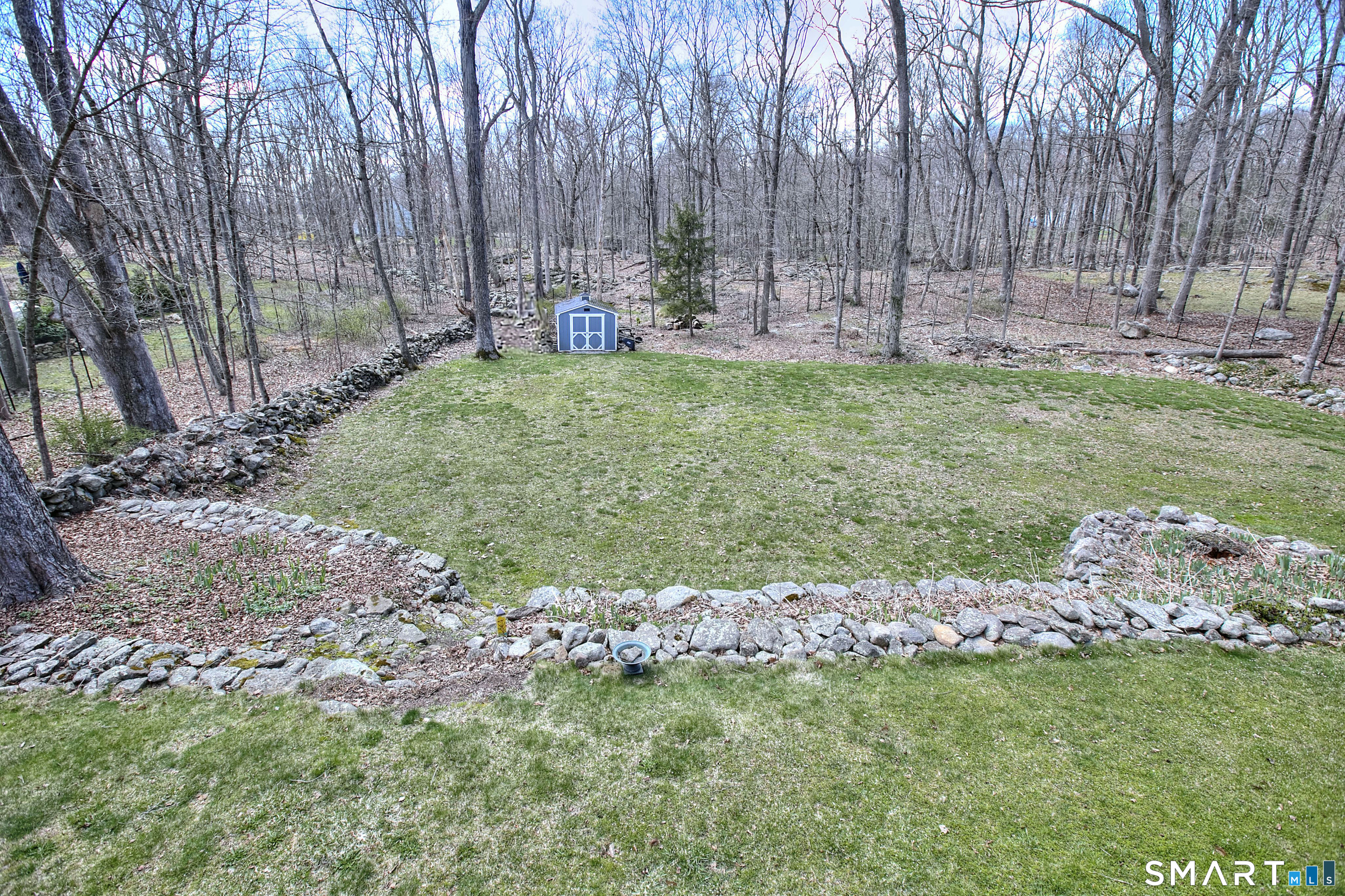 7 Richmond Hill Road Weston, CT 06883 - Photo 4 of 33 a view of a backyard with large trees
