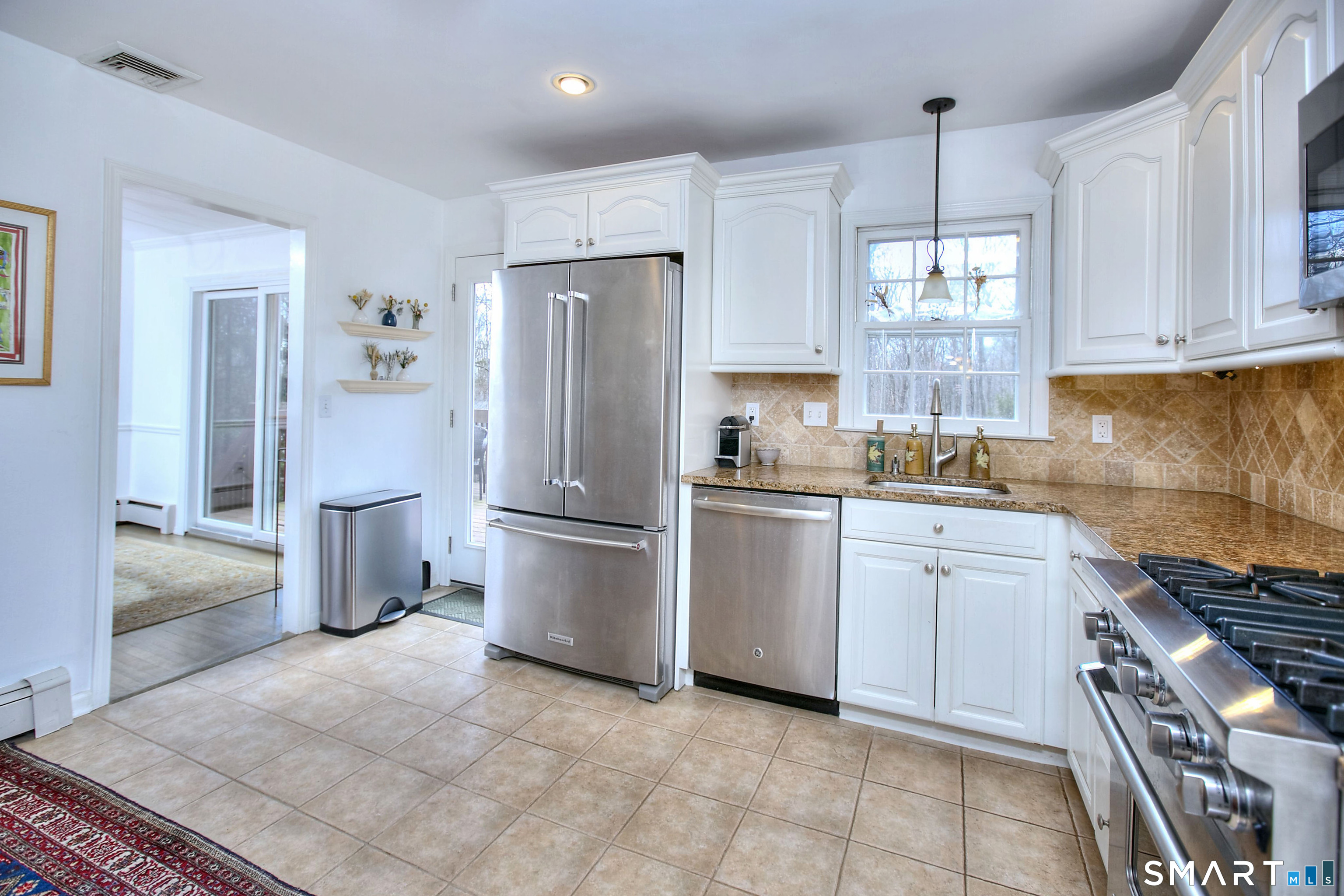 7 Richmond Hill Road Weston, CT 06883 - Photo 6 of 33 a kitchen with a refrigerator a sink and a stove