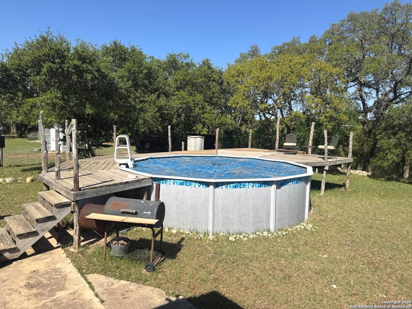2485 Bump Gate Road Pipe Creek, TX 78063 - Photo 12 of 42 a view of a swimming pool with a patio