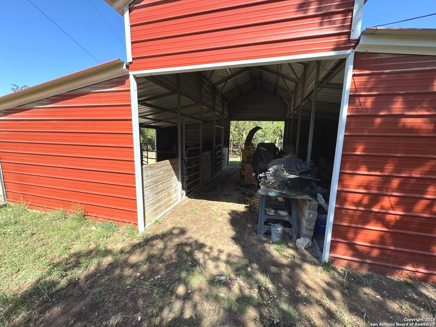 2485 Bump Gate Road Pipe Creek, TX 78063 - Photo 17 of 42 a view of backyard with cabin