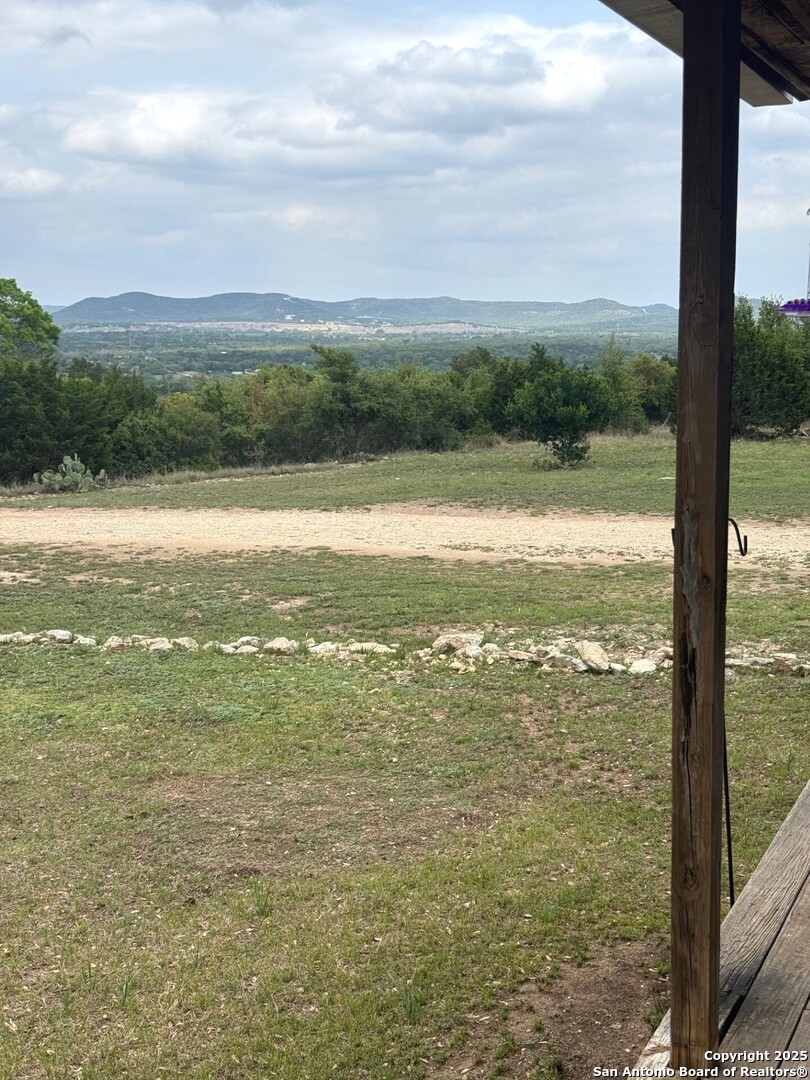 2485 Bump Gate Road Pipe Creek, TX 78063 - Photo 2 of 42 a view of an ocean from a balcony