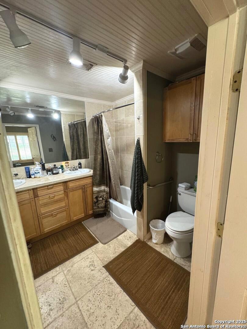 2485 Bump Gate Road Pipe Creek, TX 78063 - Photo 33 of 42 a bathroom with a sink a toilet and a shower