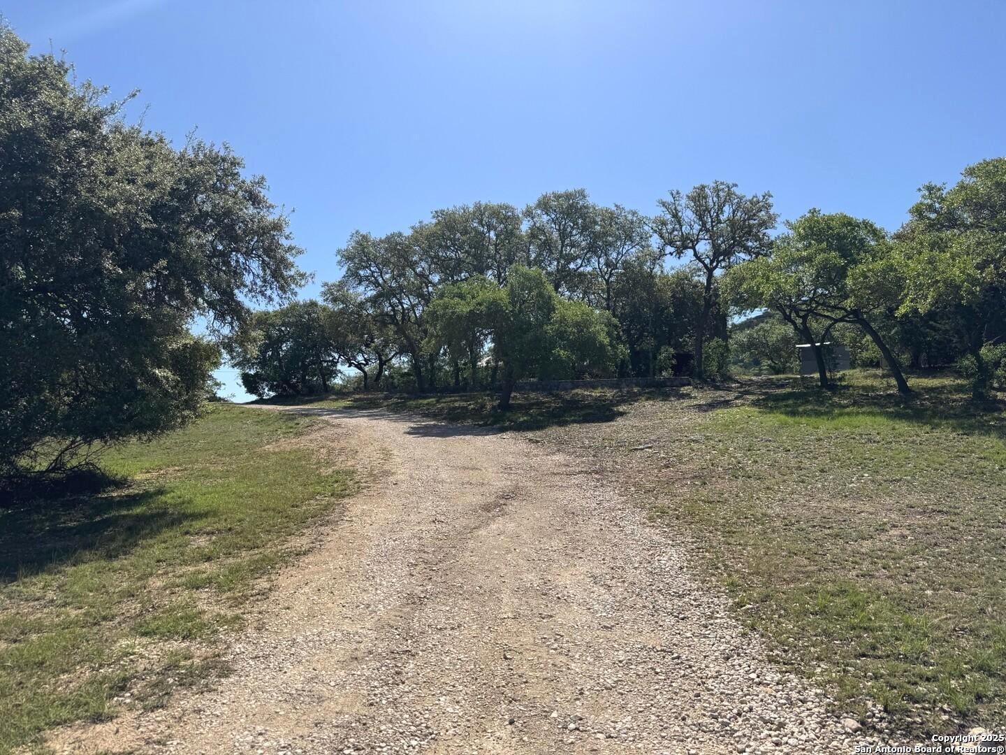 2485 Bump Gate Road Pipe Creek, TX 78063 - Photo 4 of 42 a view of outdoor space with trees all around