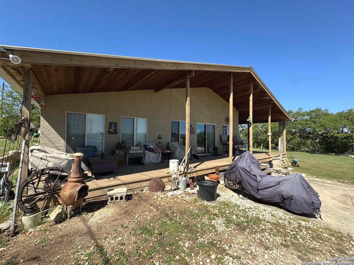 2485 Bump Gate Road Pipe Creek, TX 78063 - Photo 8 of 42 a view of a lounge chair in the patio