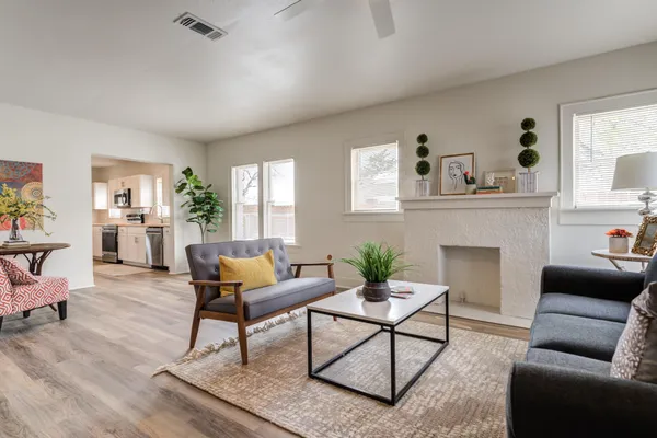a living room with furniture and a fireplace