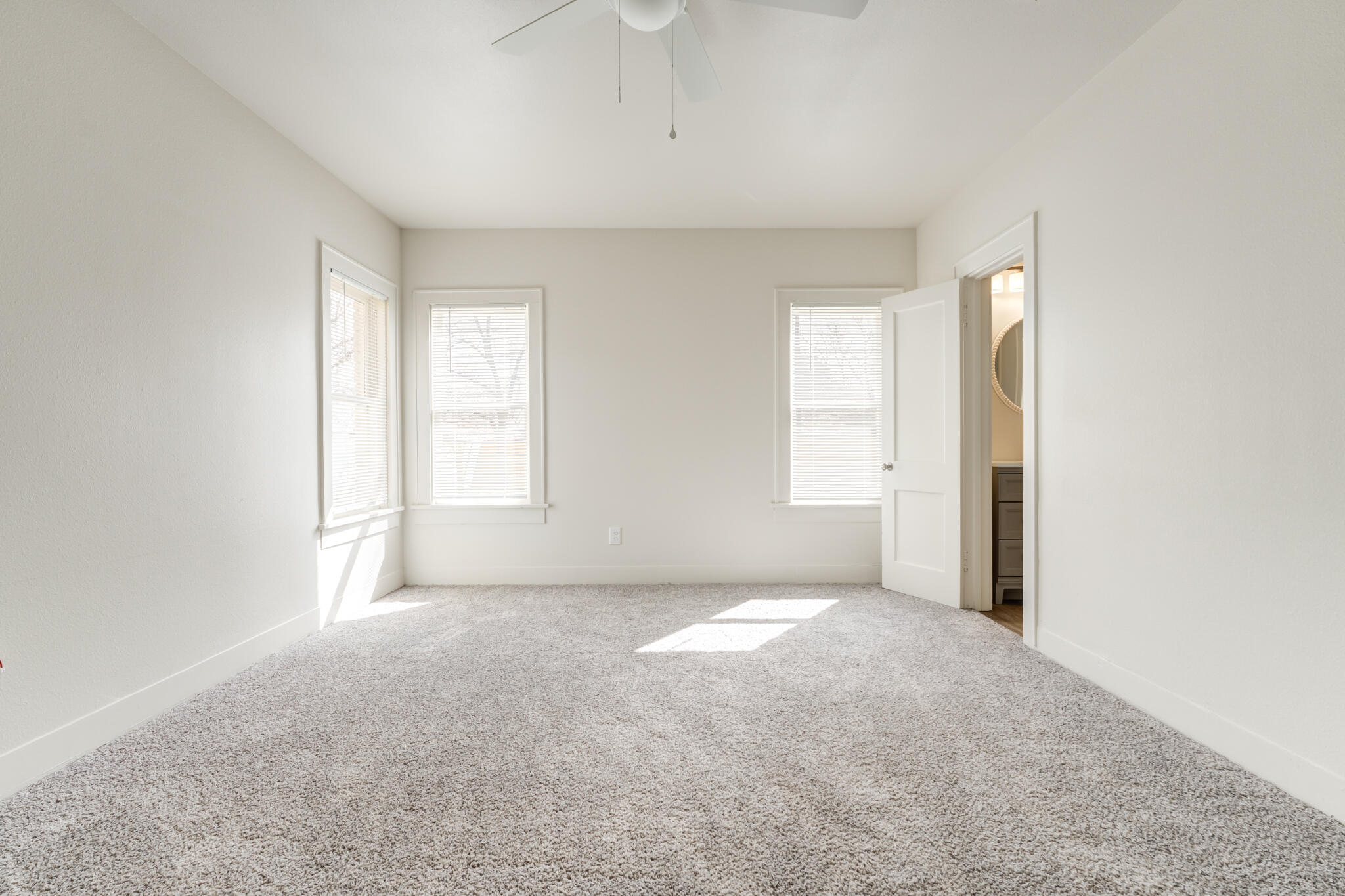 1721 23rd Street Lubbock, TX 79411 - Photo 14 of 29 an empty room with windows and closet