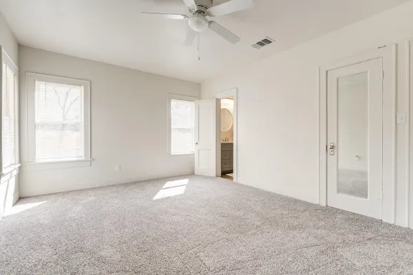 a view of an empty room with a window