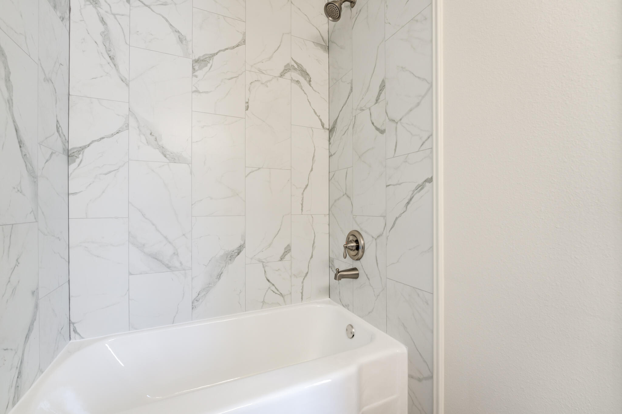 1721 23rd Street Lubbock, TX 79411 - Photo 17 of 29 a bathroom with a bathtub