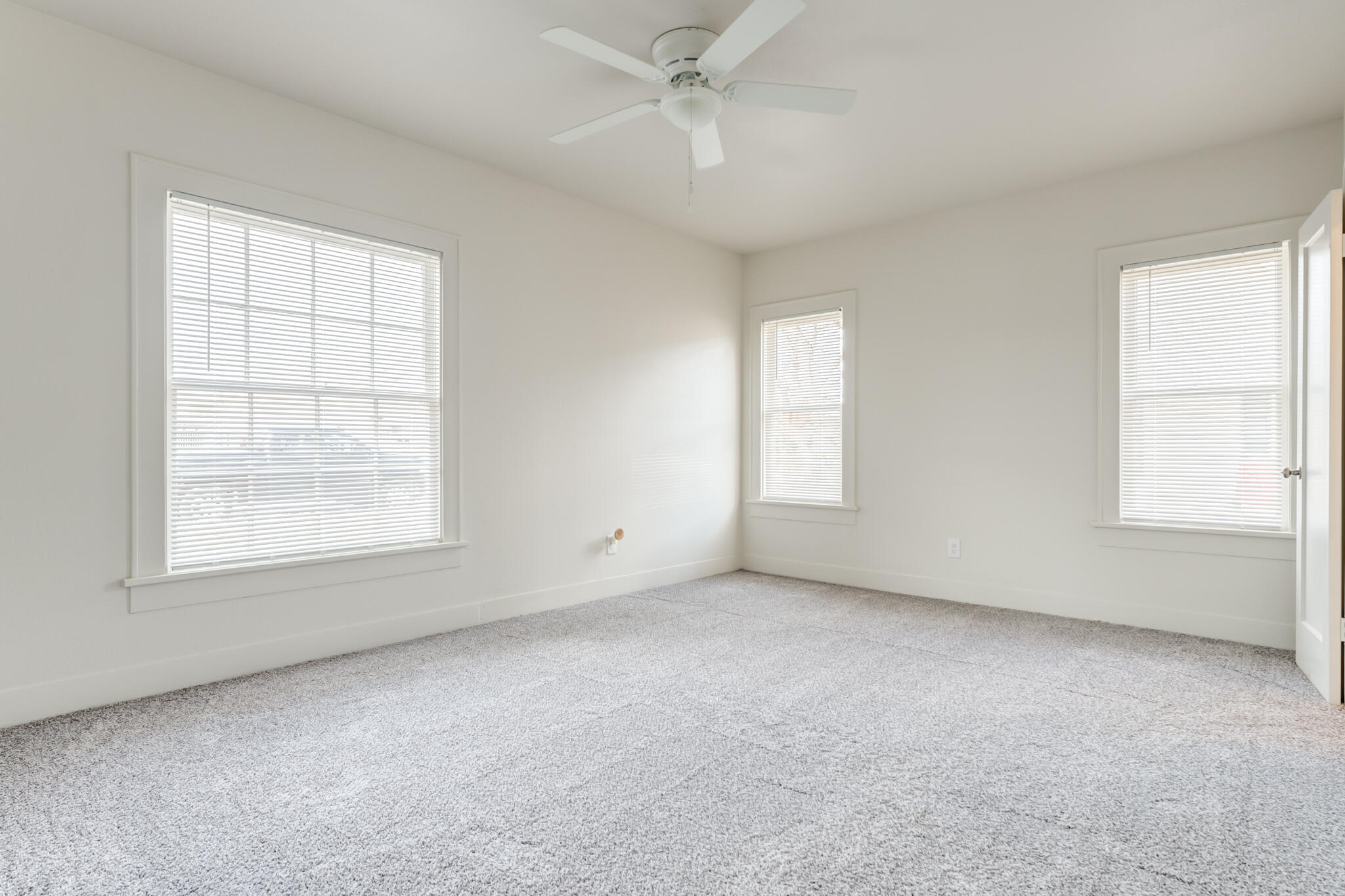 1721 23rd Street Lubbock, TX 79411 - Photo 23 of 29 an empty room with a window and a kitchen