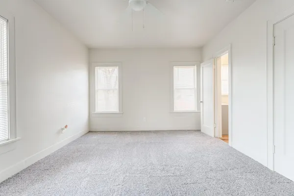 an empty room with windows