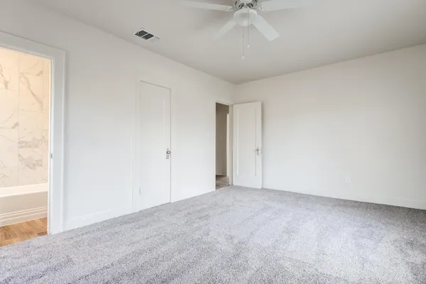 an empty room with a empty space and a window