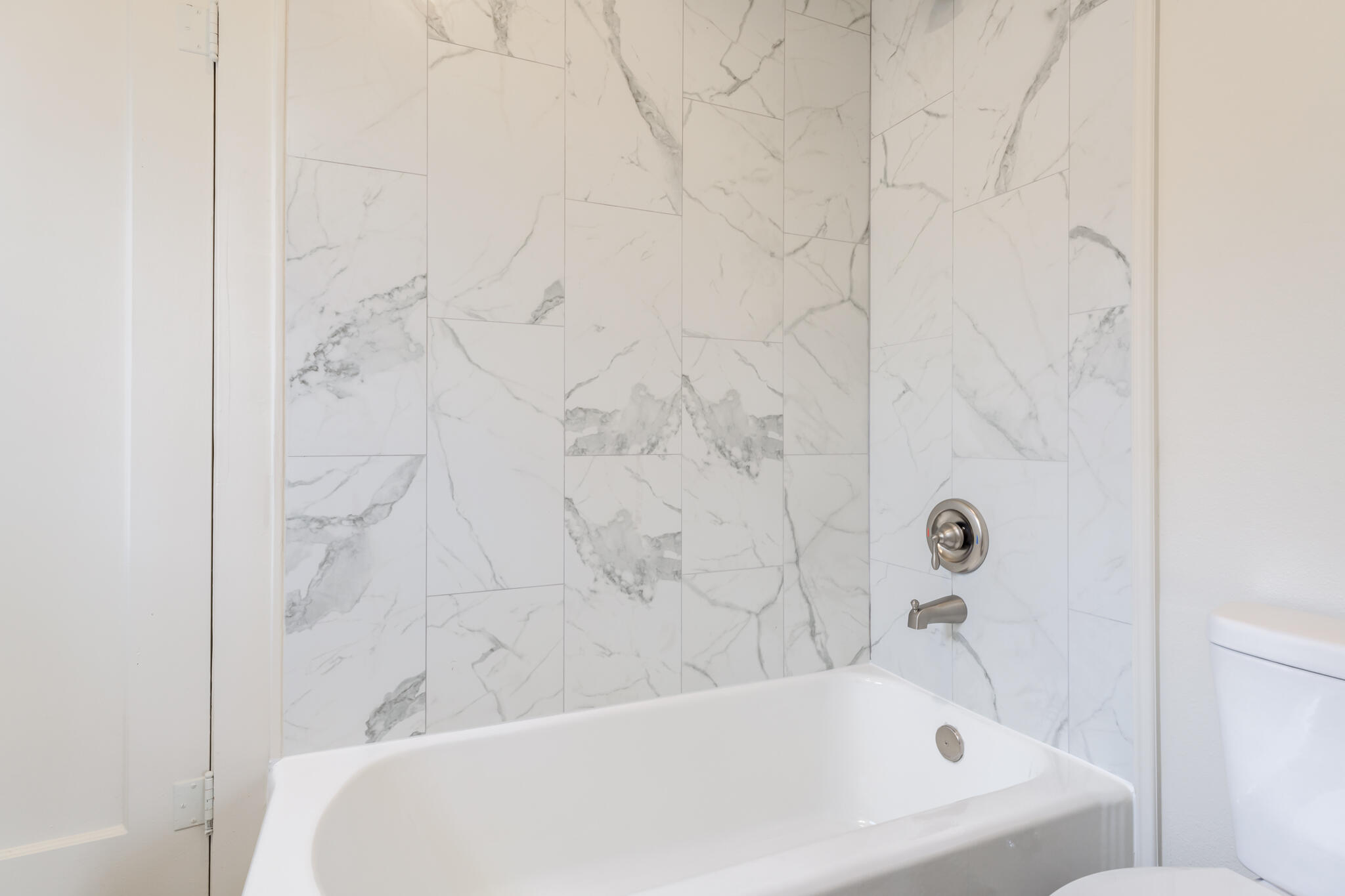 1721 23rd Street Lubbock, TX 79411 - Photo 26 of 29 a bathroom with a bathtub