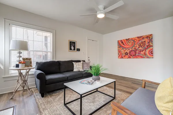 a living room with furniture and a large window