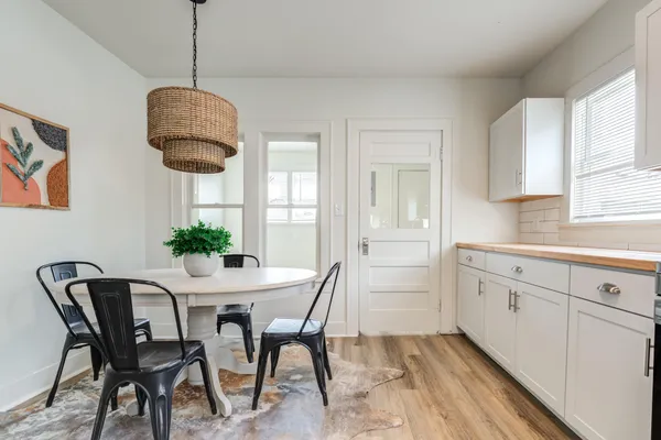 a dining room with furniture and window