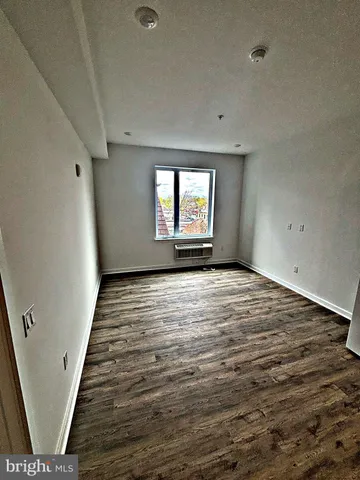 a room with furniture and wooden floor