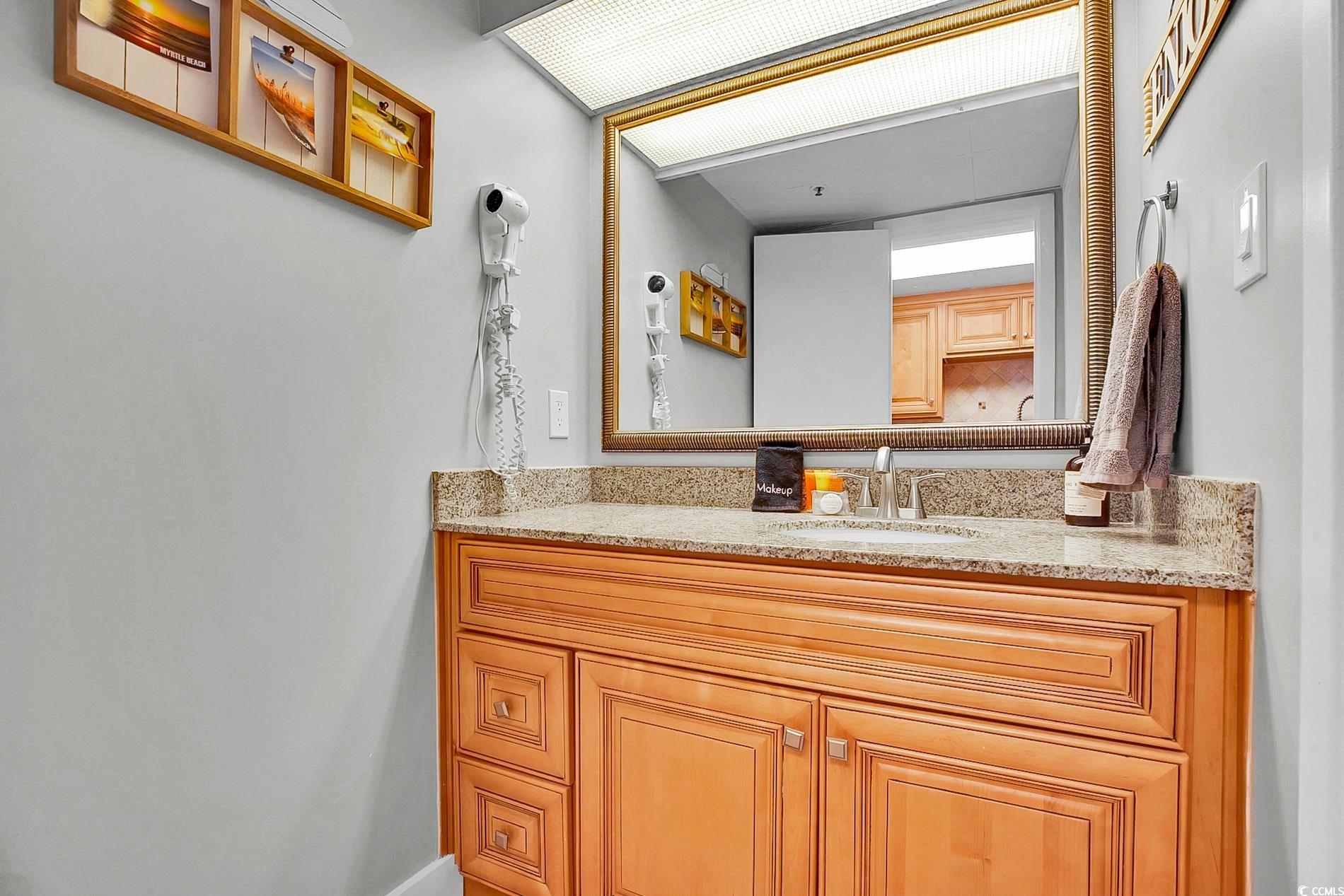 7200 North Ocean Boulevard, Unit 553 Myrtle Beach, SC 29572 - Photo 14 of 27 Bedroom featuring light wood-style flooring