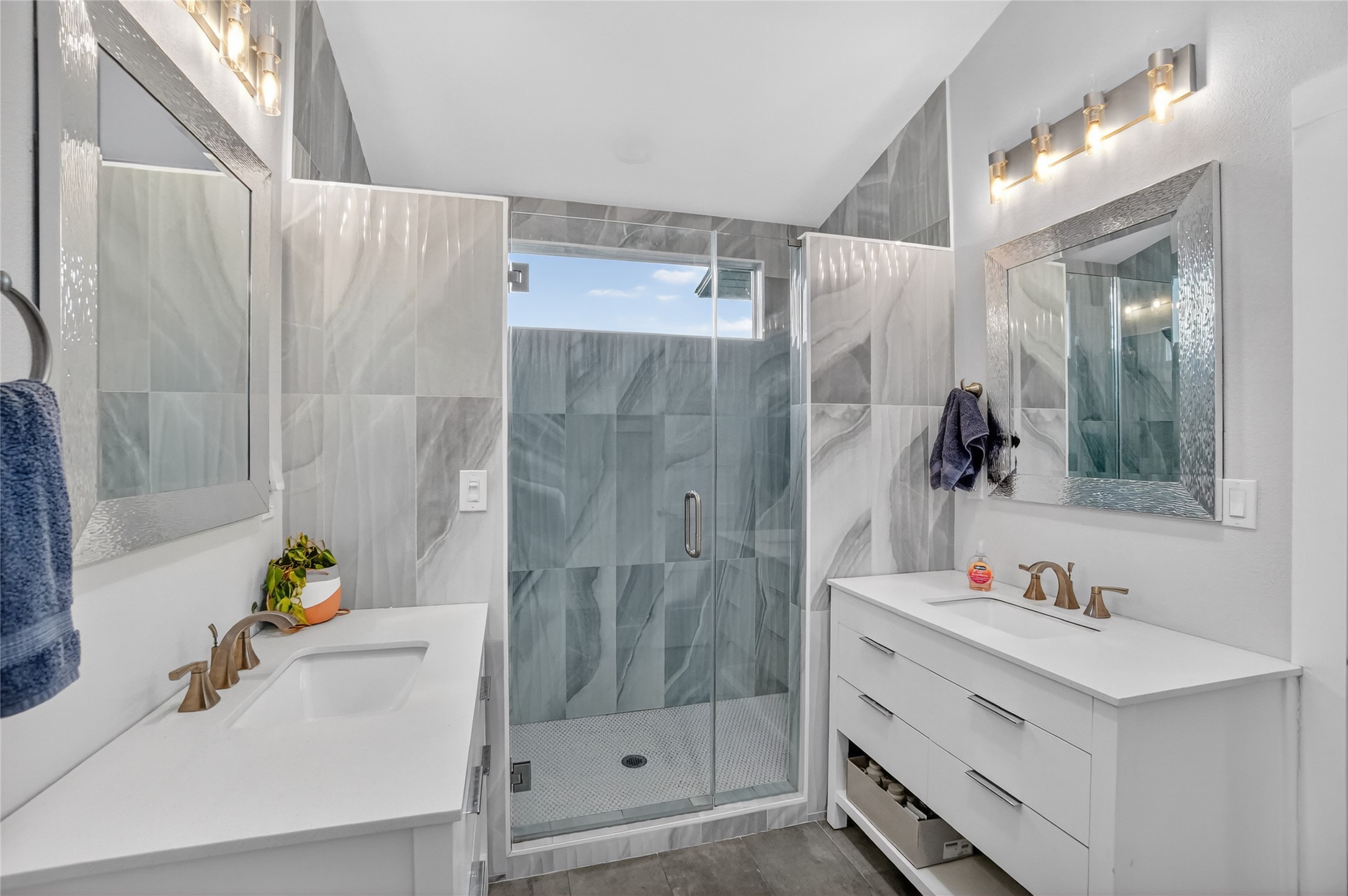3627 Stoneridge Road Austin, TX 78746 - Photo 34 of 40 Bathroom with two vanities and a marble finish shower