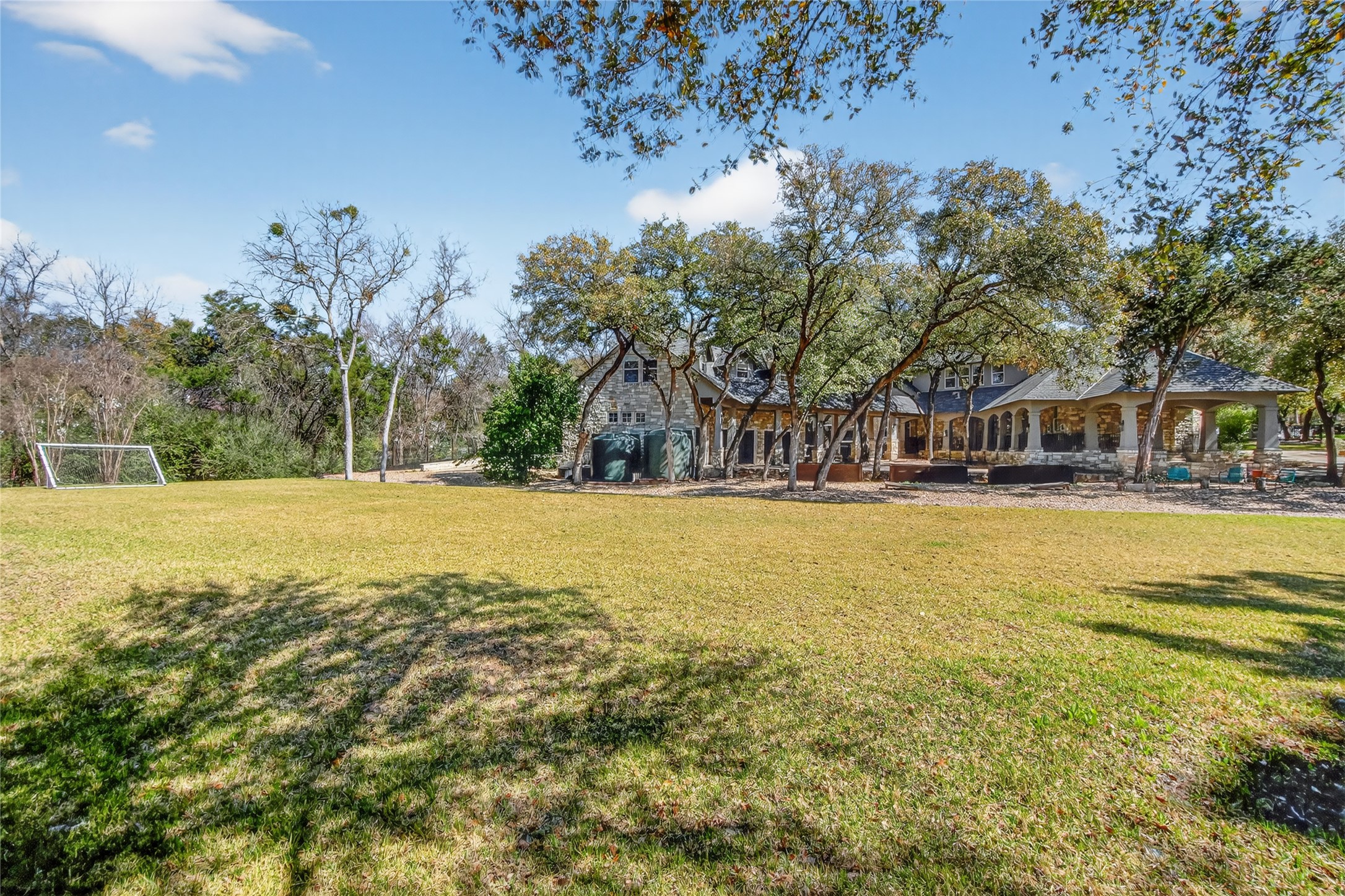3627 Stoneridge Road Austin, TX 78746 - Photo 36 of 40 View of yard with a patio area and an area for soccer
