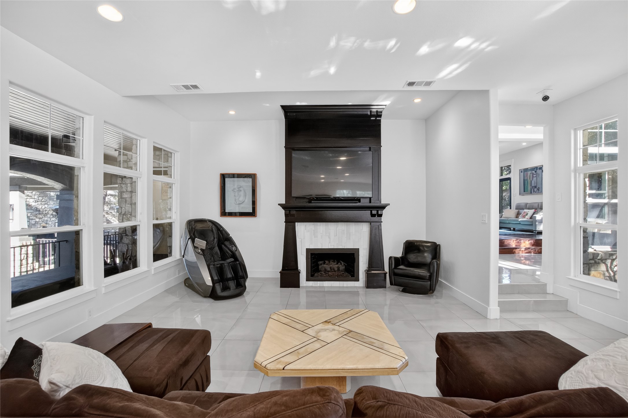 3627 Stoneridge Road Austin, TX 78746 - Photo 5 of 40 Living area with a fireplace, light tile patterned flooring, and recessed lighting