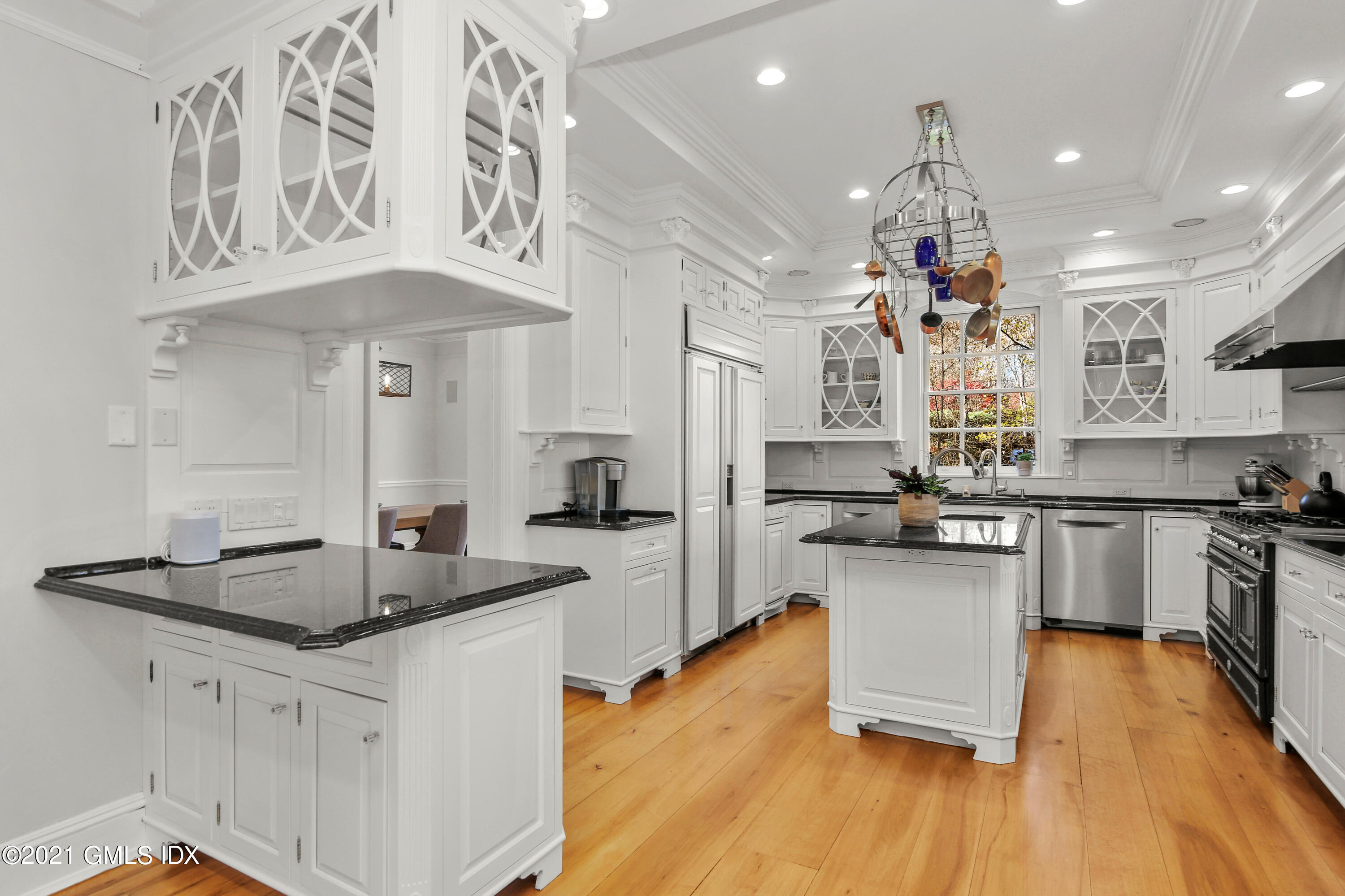 1 Juniper Hill Road Greenwich, CT 06830 - Photo 17 of 73 a kitchen with stainless steel appliances granite countertop a sink stove and refrigerator
