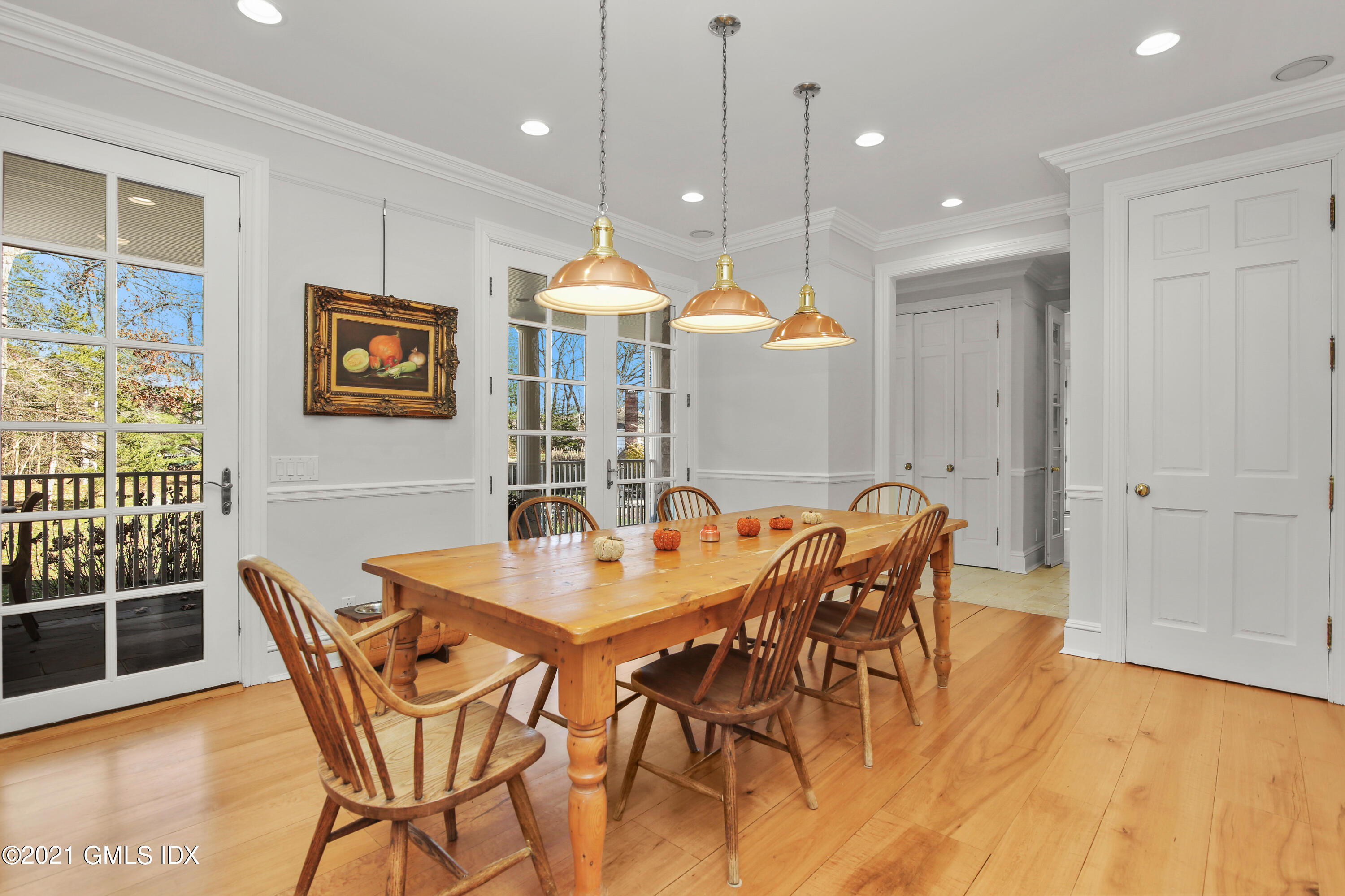 1 Juniper Hill Road Greenwich, CT 06830 - Photo 19 of 73 a view of a dining room with furniture window and wooden floor