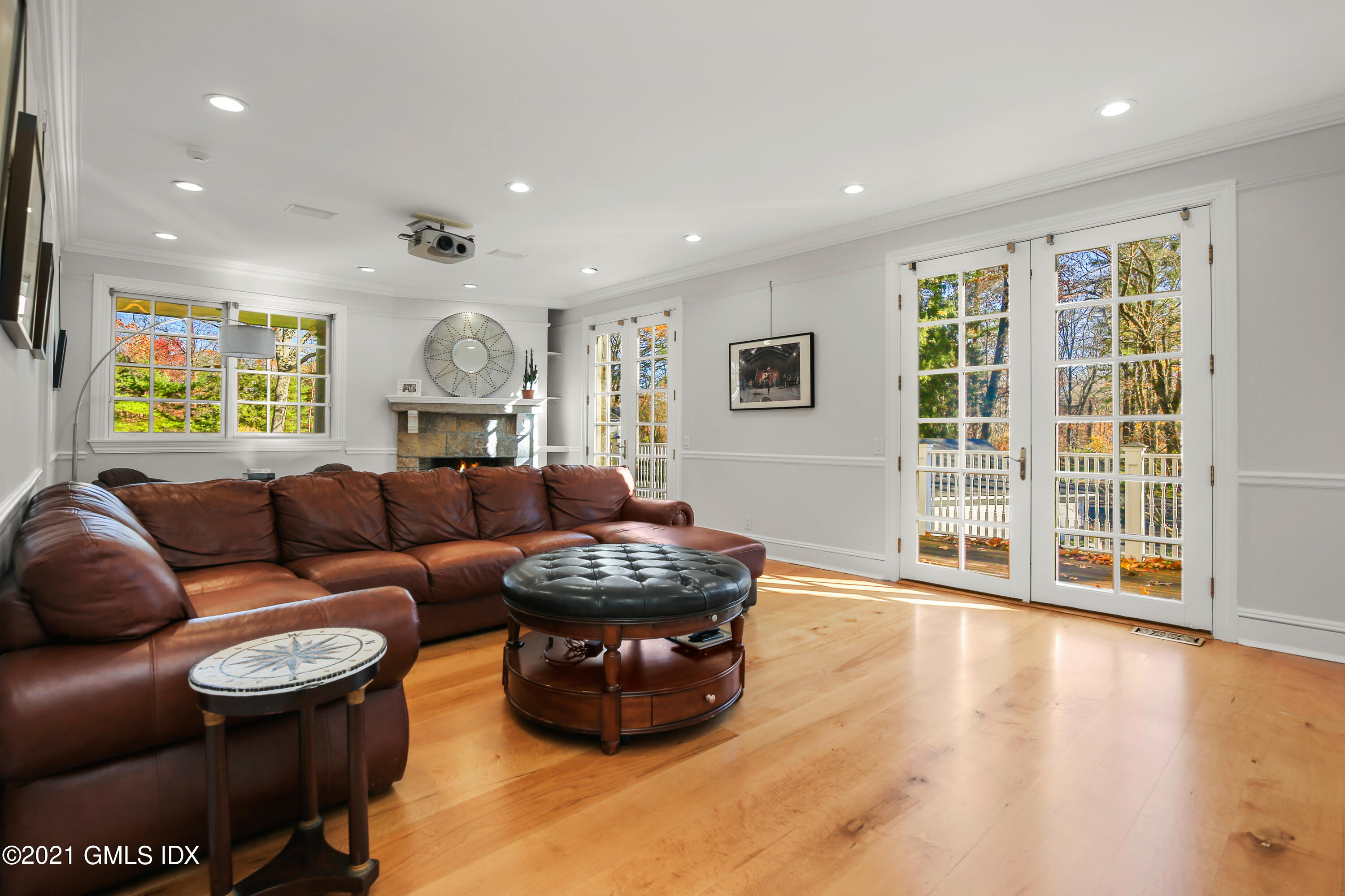 1 Juniper Hill Road Greenwich, CT 06830 - Photo 24 of 73 a living room with furniture and a flat screen tv