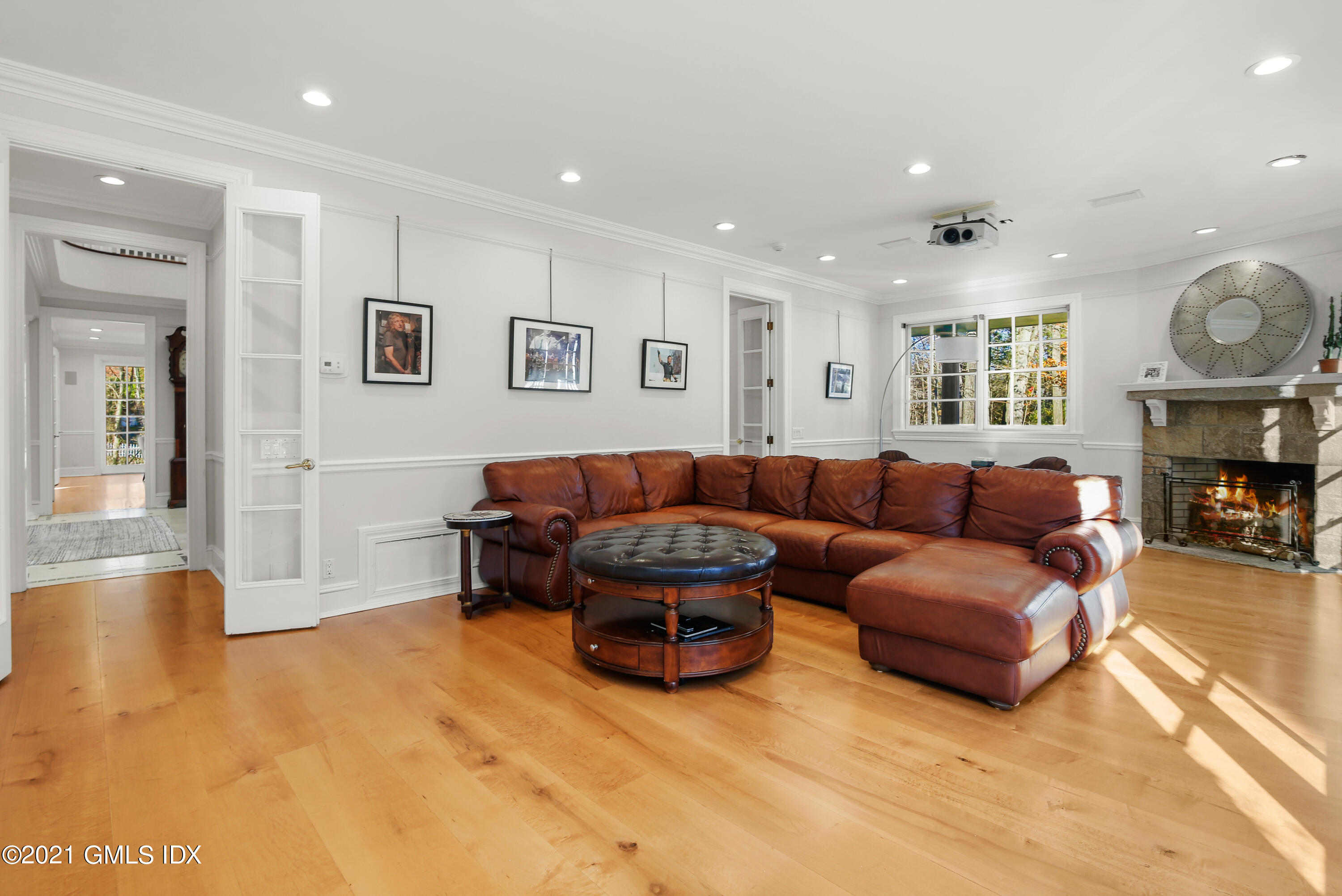 1 Juniper Hill Road Greenwich, CT 06830 - Photo 25 of 73 a living room with furniture a fireplace and a large window