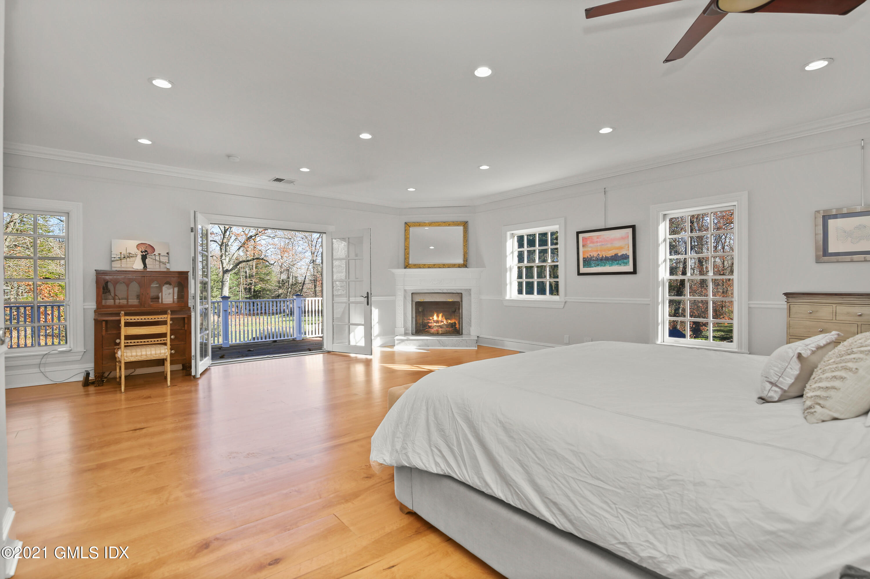 1 Juniper Hill Road Greenwich, CT 06830 - Photo 33 of 73 a spacious bedroom with a large bed and a flat screen tv