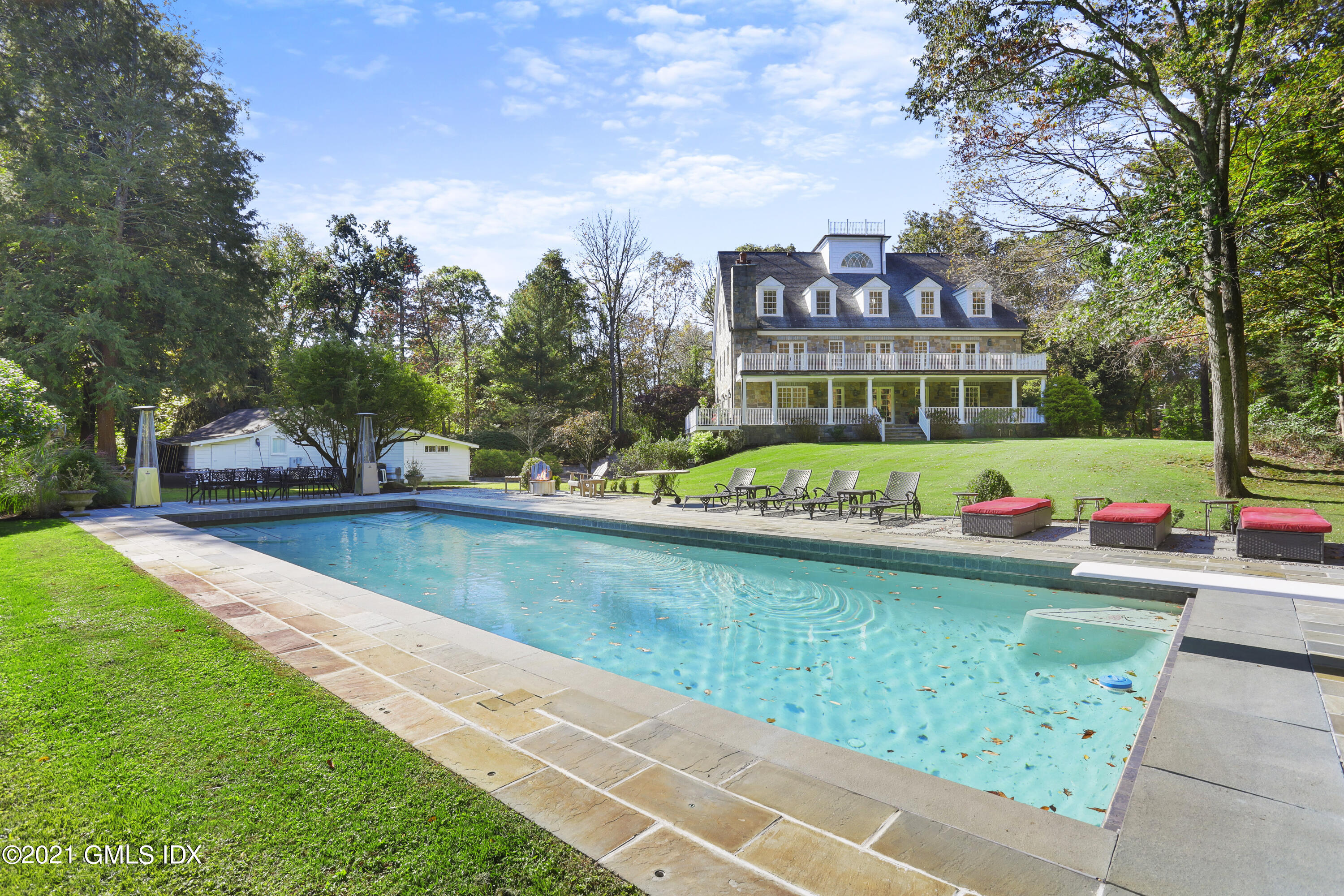 1 Juniper Hill Road Greenwich, CT 06830 - Photo 58 of 73 a view of a house with a yard and sitting area