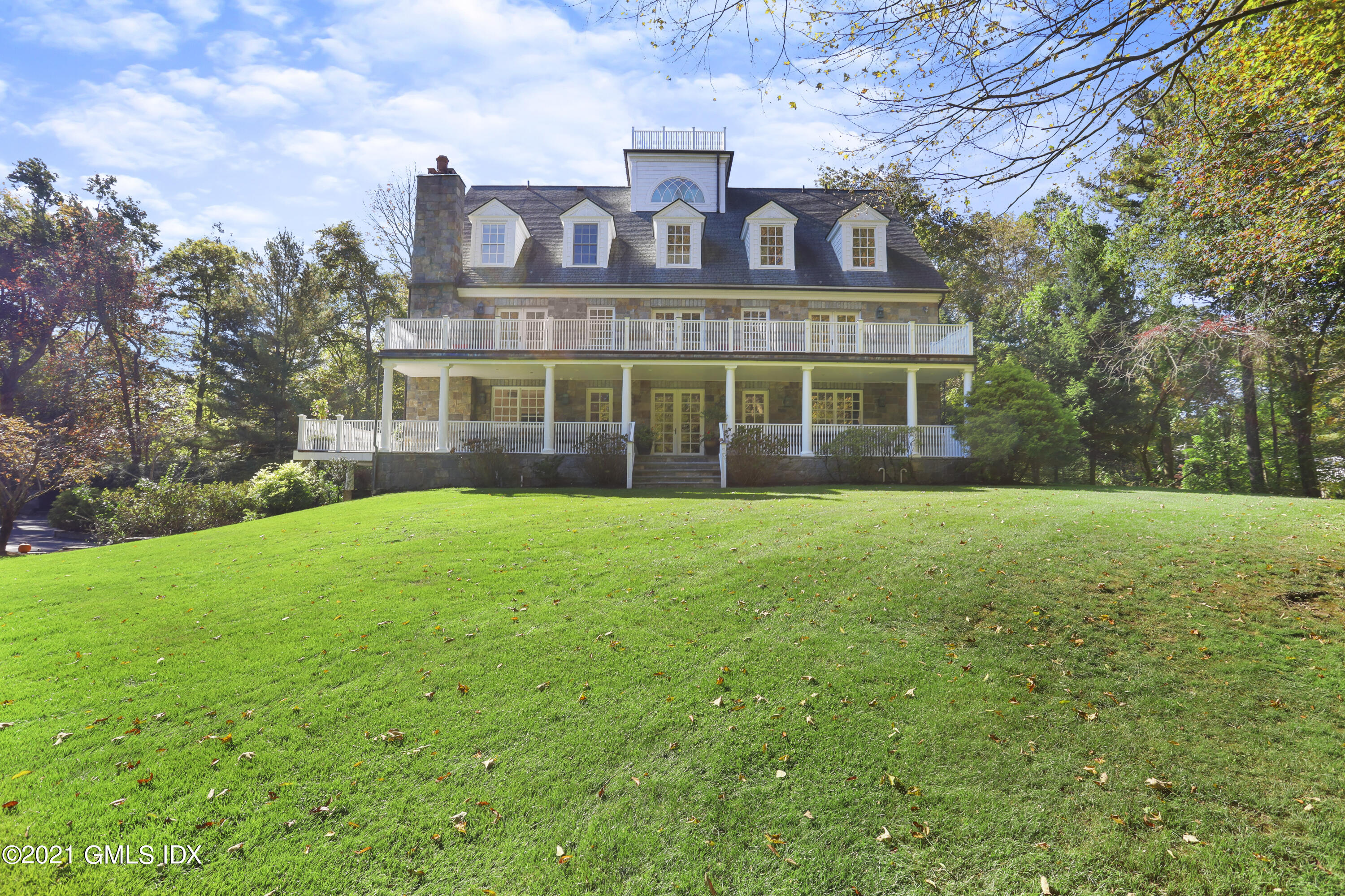 1 Juniper Hill Road Greenwich, CT 06830 - Photo 64 of 73 a view of a brick building next to a yard