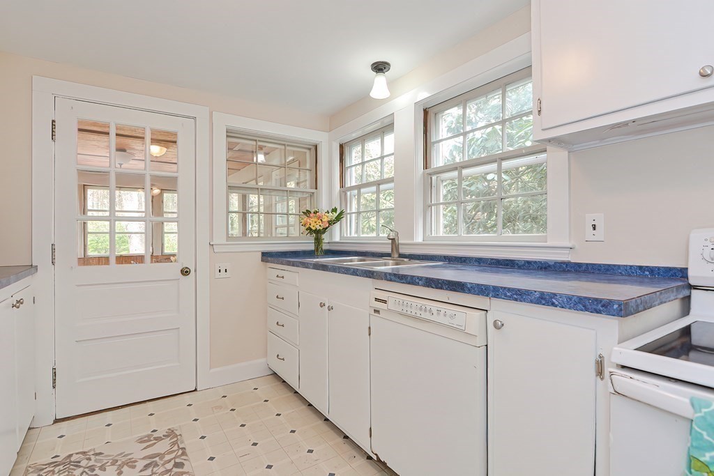 38 Red Acre Road Stow, MA 01775 - Photo 12 of 41 a utility room with granite countertop a sink and a window