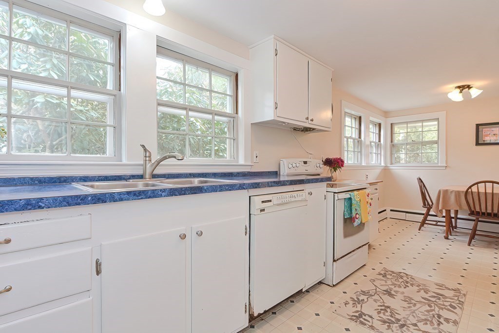 38 Red Acre Road Stow, MA 01775 - Photo 18 of 41 a kitchen with granite countertop white cabinets and white appliances