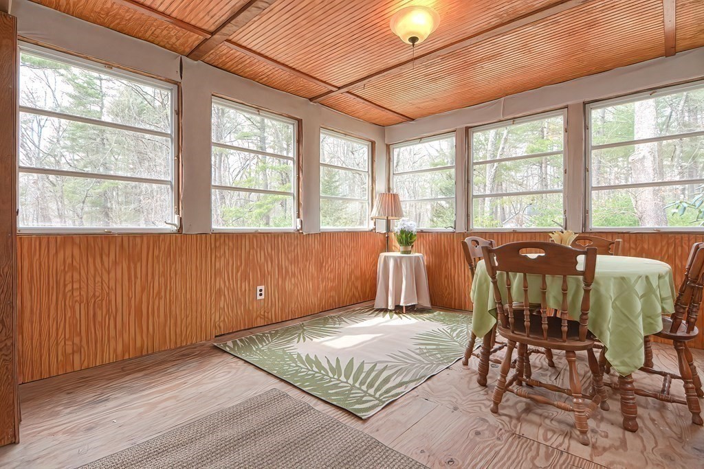 38 Red Acre Road Stow, MA 01775 - Photo 19 of 41 a spacious bedroom with a bed a table and chair
