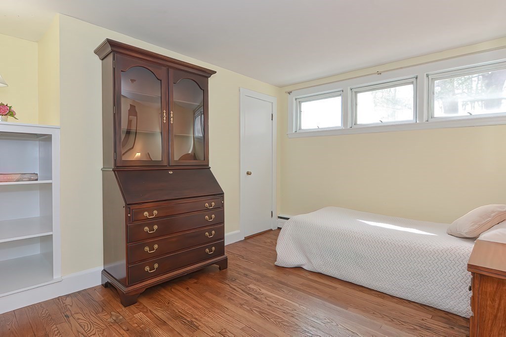 38 Red Acre Road Stow, MA 01775 - Photo 24 of 41 a bedroom with a bed and a dresser