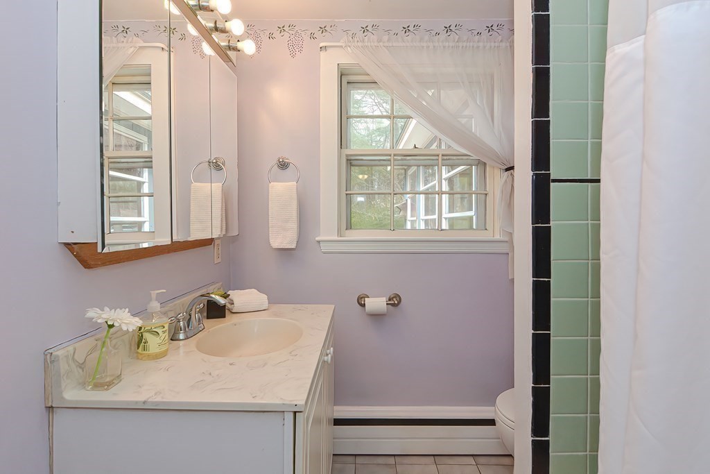 38 Red Acre Road Stow, MA 01775 - Photo 27 of 41 a bathroom with a sink and a mirror