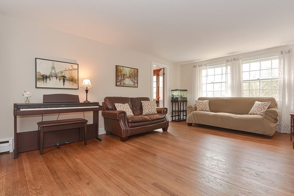 38 Red Acre Road Stow, MA 01775 - Photo 4 of 41 a living room with furniture and a wooden floor
