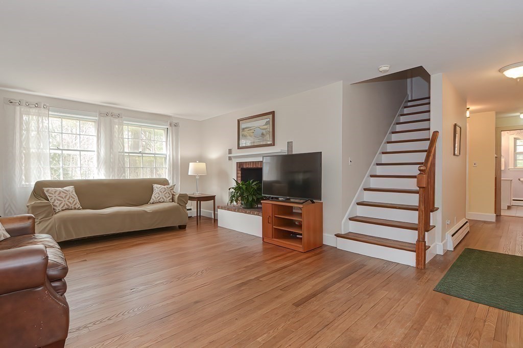 38 Red Acre Road Stow, MA 01775 - Photo 5 of 41 a living room with furniture and a flat screen tv