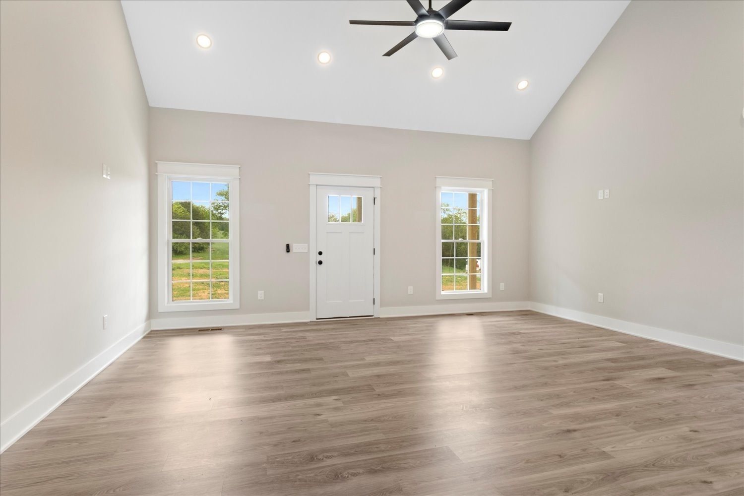 3180 Jett Road Pulaski, TN 38478 - Photo 4 of 27 a view of an empty room with wooden floor and a window