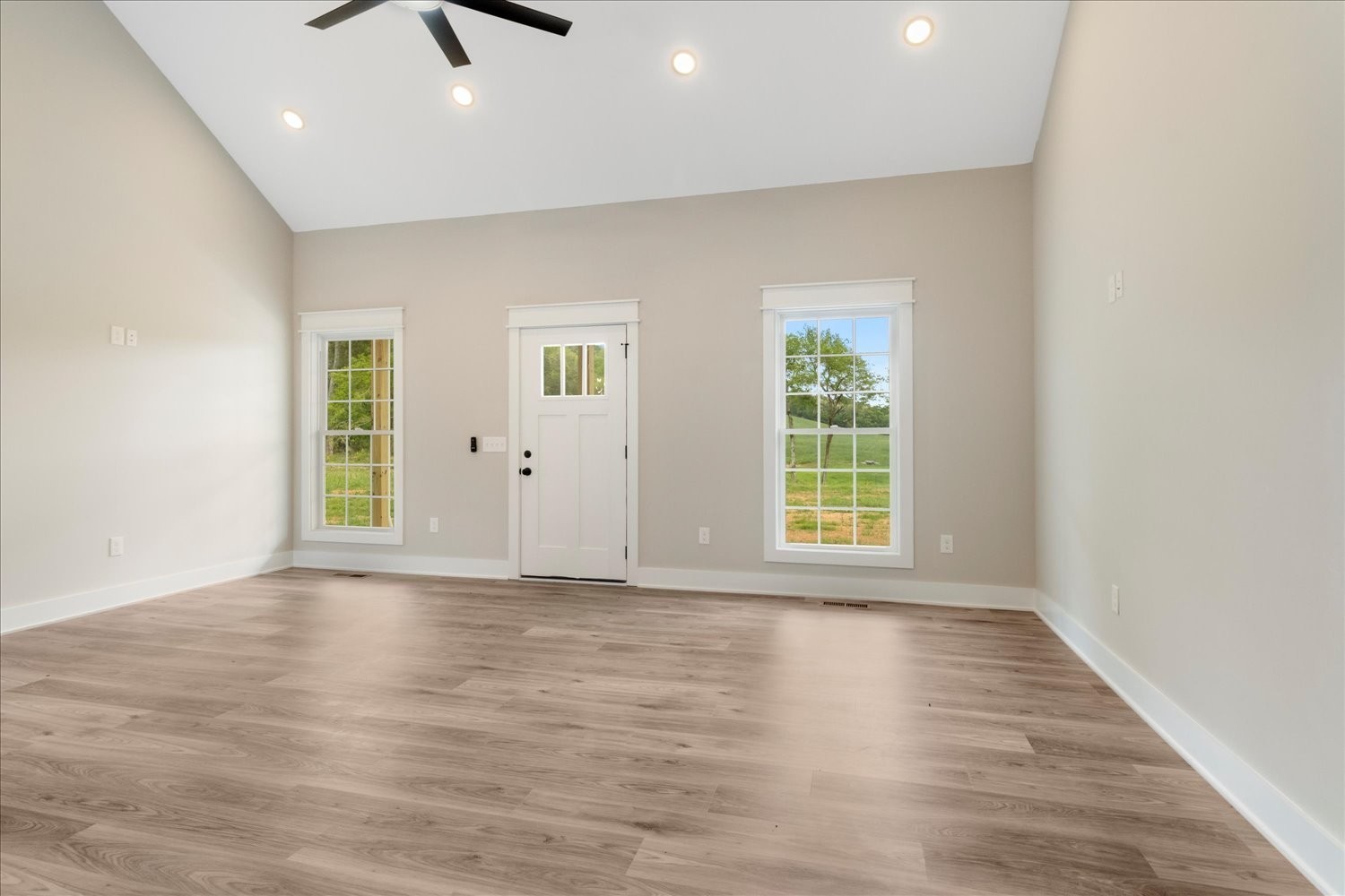 3180 Jett Road Pulaski, TN 38478 - Photo 6 of 27 an empty room with wooden floor and windows