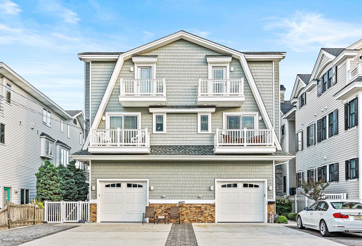 4477 Venicean Road, Unit SOUTH Sea Isle City, NJ 08243 - Photo 1 of 36 a front view of a residential apartment building with a street