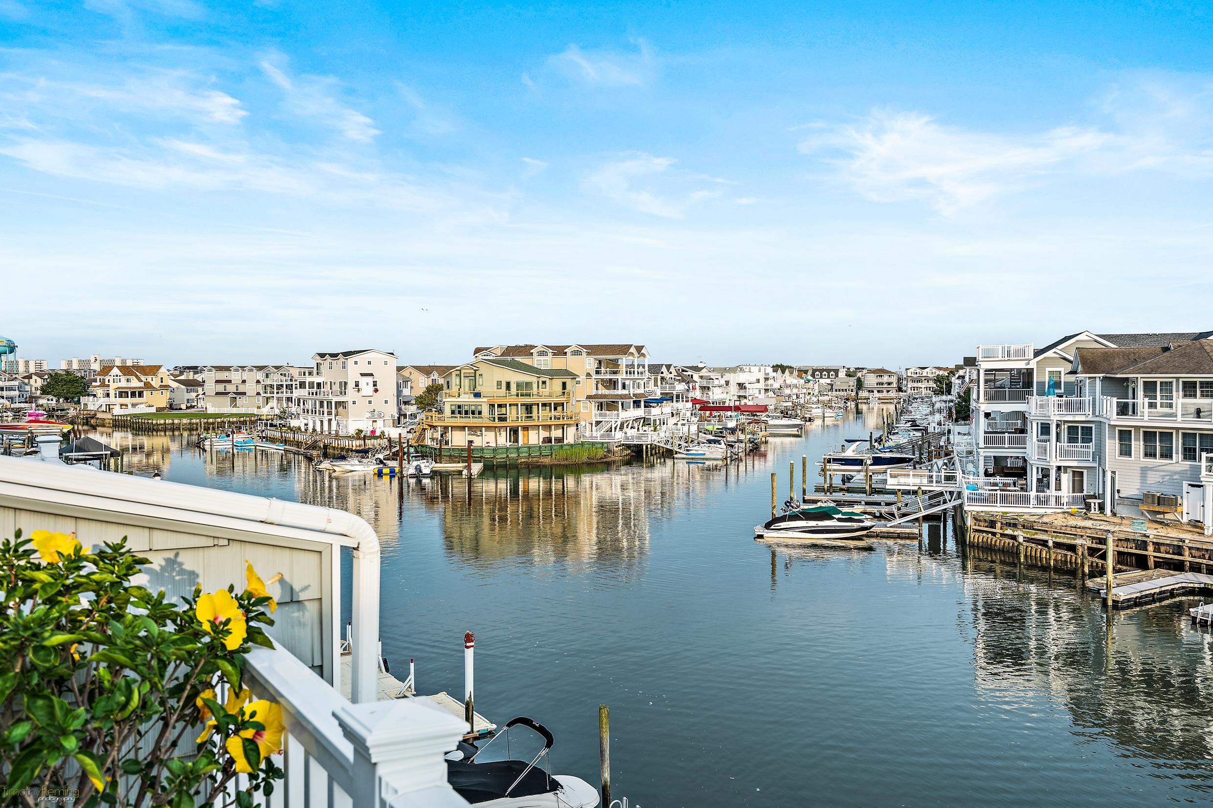4477 Venicean Road, Unit SOUTH Sea Isle City, NJ 08243 - Photo 12 of 36 a view of a lake with a city