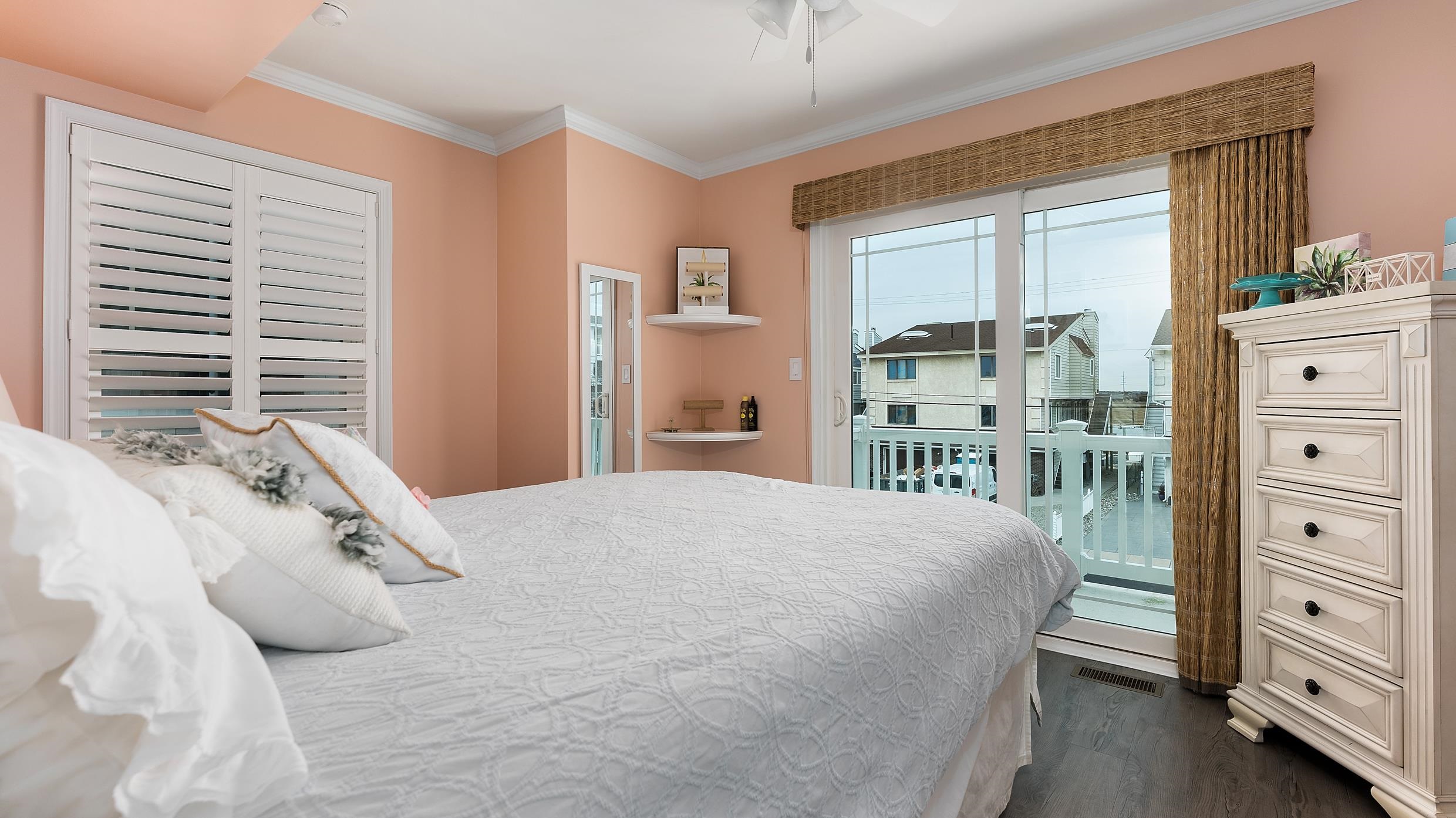 4477 Venicean Road, Unit SOUTH Sea Isle City, NJ 08243 - Photo 17 of 36 a bedroom with a bed and a dresser