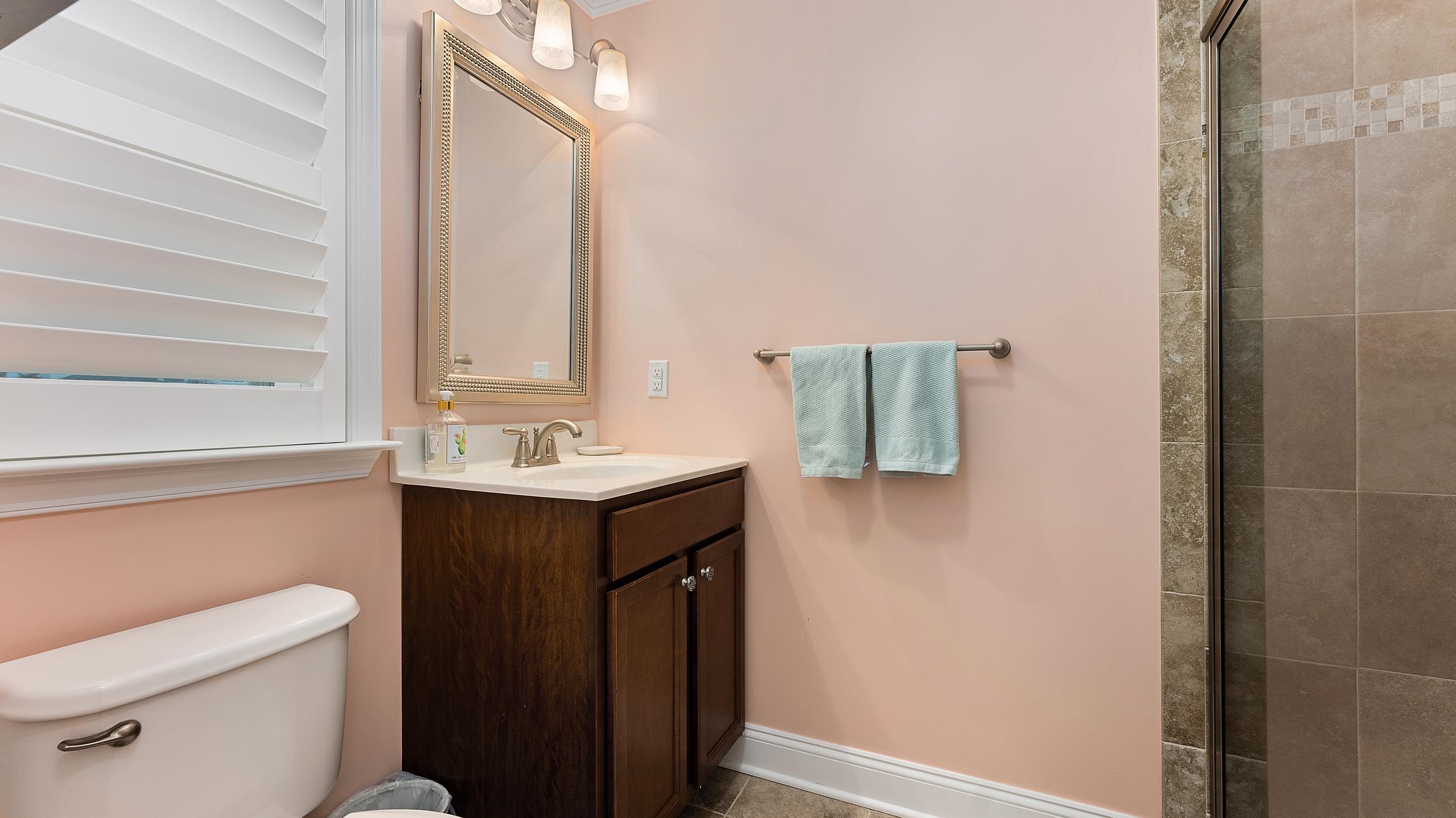 4477 Venicean Road, Unit SOUTH Sea Isle City, NJ 08243 - Photo 18 of 36 a bathroom with a sink and a mirror