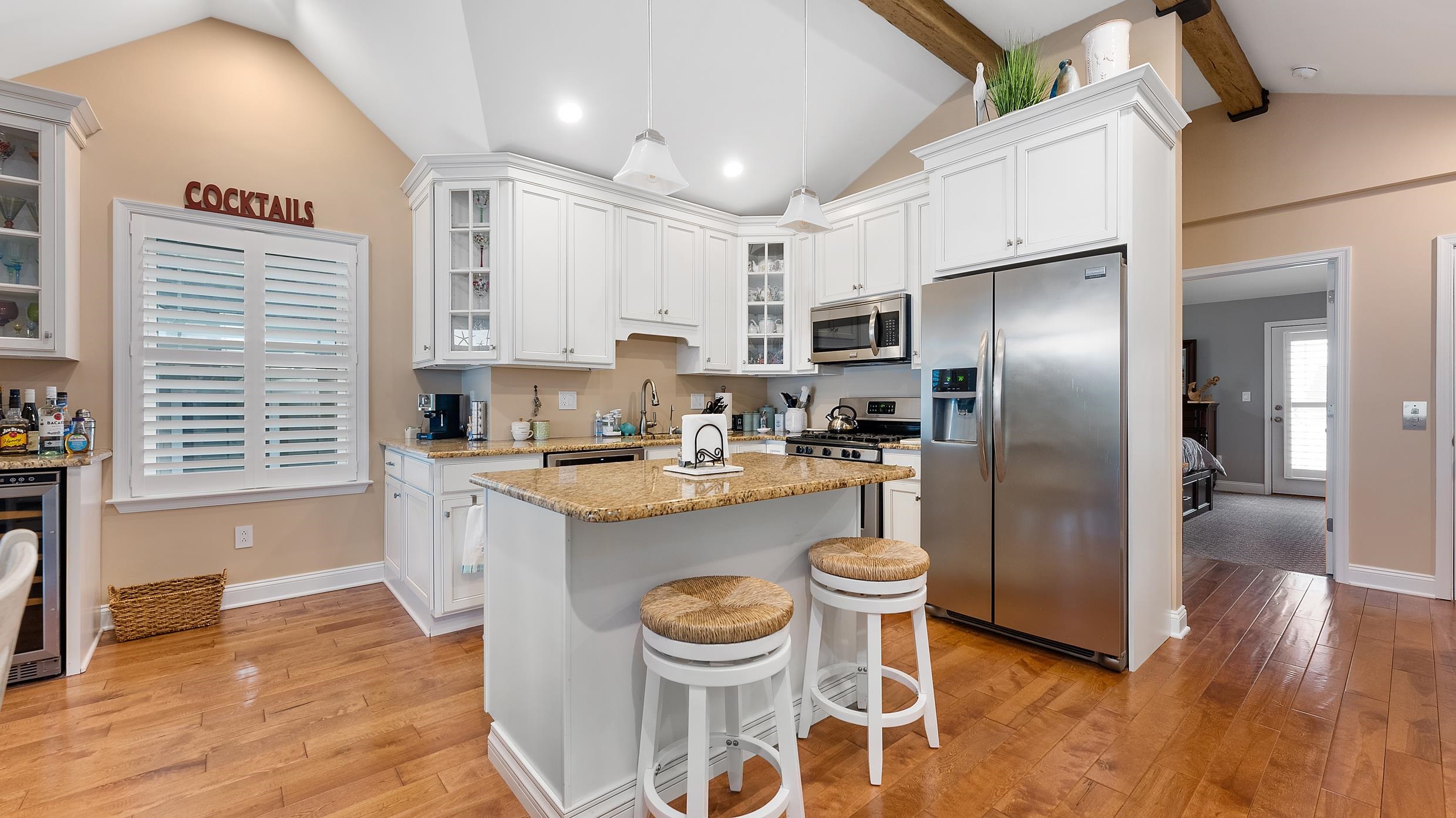 4477 Venicean Road, Unit SOUTH Sea Isle City, NJ 08243 - Photo 2 of 36 a kitchen with stainless steel appliances a refrigerator a stove a sink dishwasher and white cabinets with wooden floor