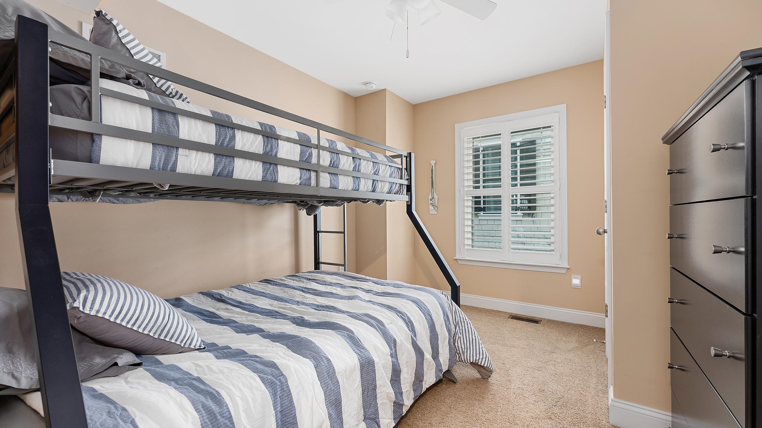 4477 Venicean Road, Unit SOUTH Sea Isle City, NJ 08243 - Photo 25 of 36 a bedroom with a bed and a window